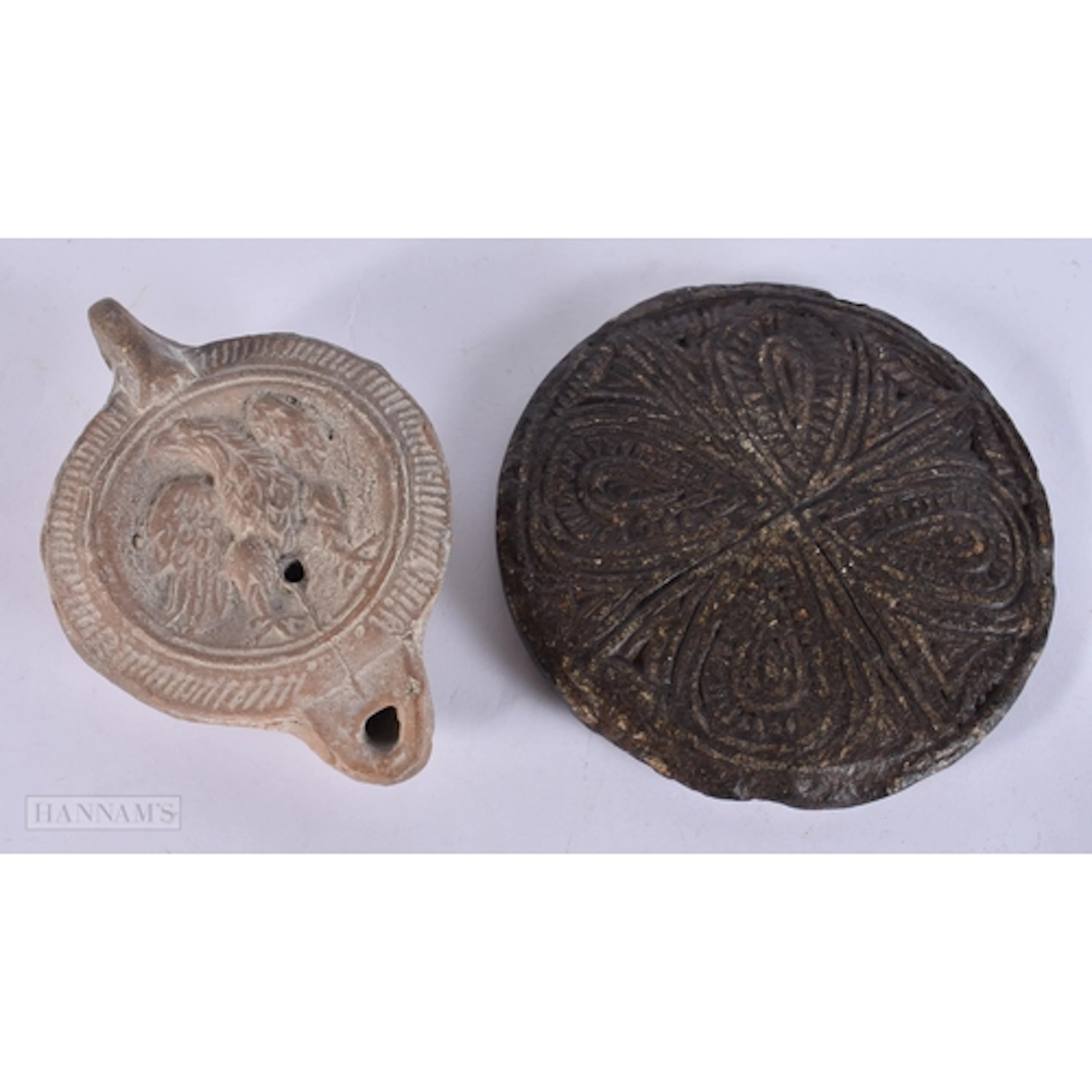 AN UNUSUAL EARLY CARVED POT COVER together with an antiquity...