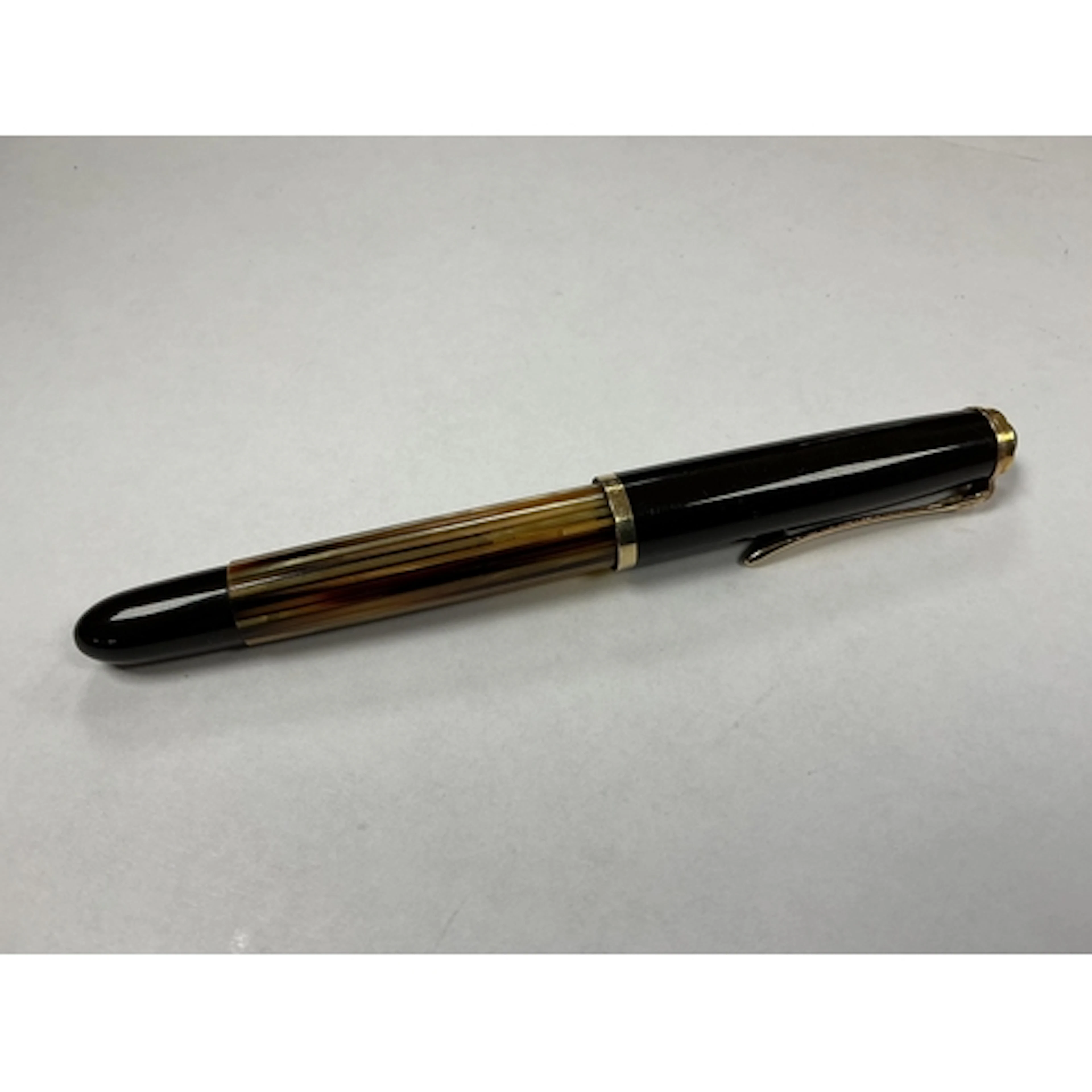 A Pelikan 400 tortoiseshell piston fill pen with gold filled...