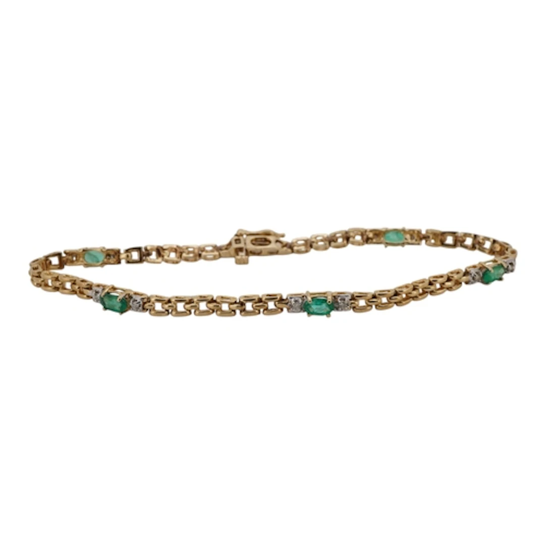 A recent 14k, emerald and diamond bracelet, set with five em...