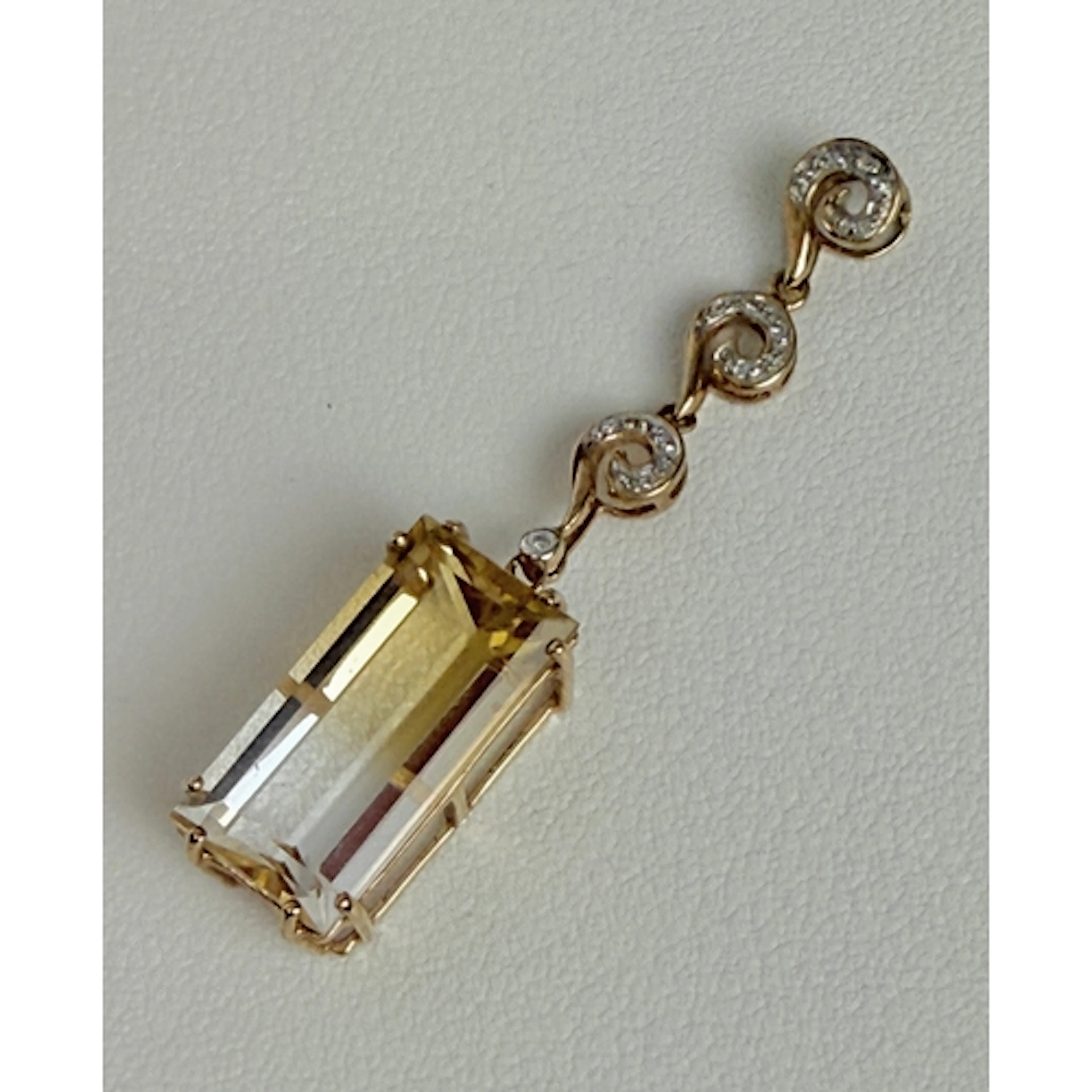 A 9ct yellow gold, watermelon tourmaline and diamond pendant...