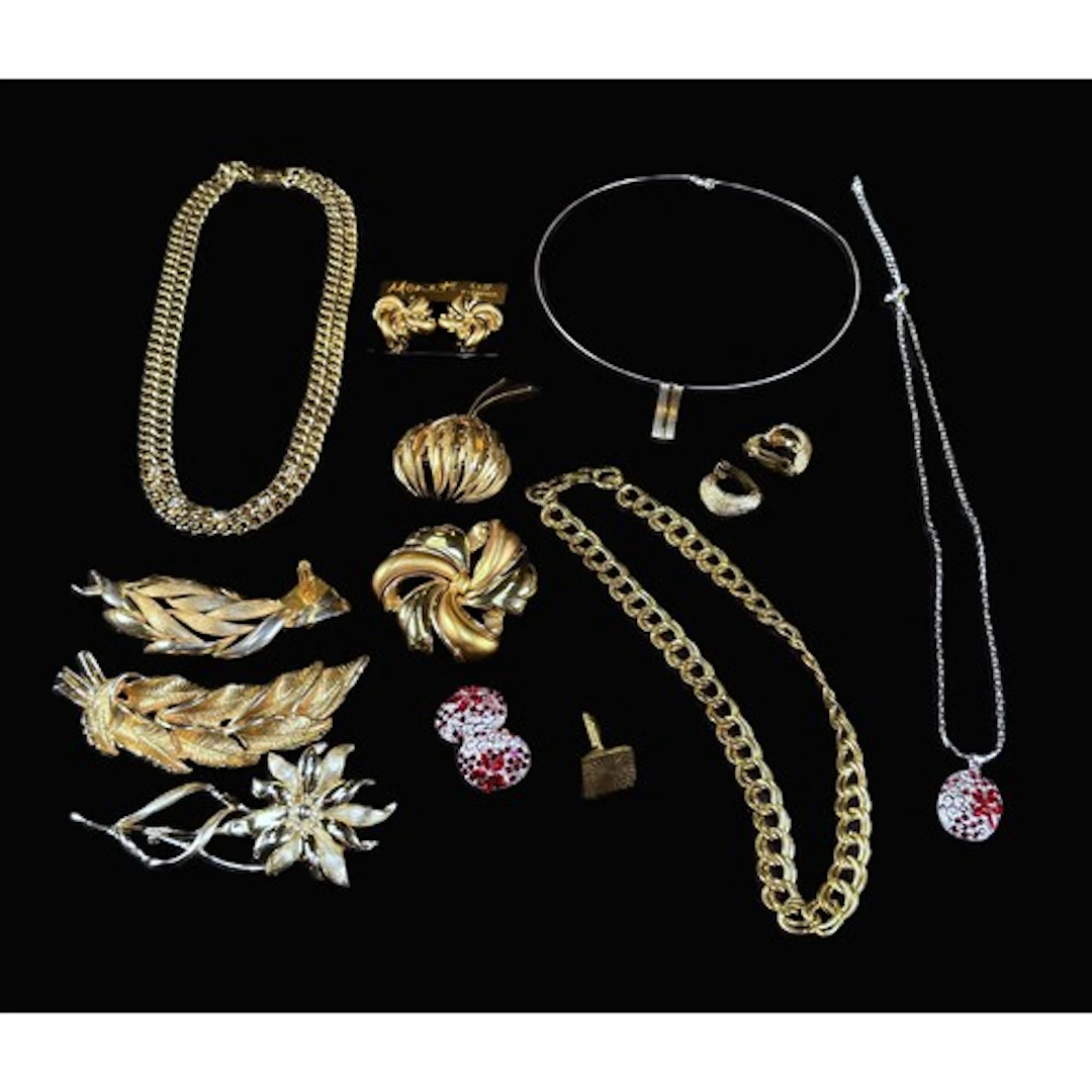 A Monet gilt necklace, earrings and brooch, other gilt brooc...