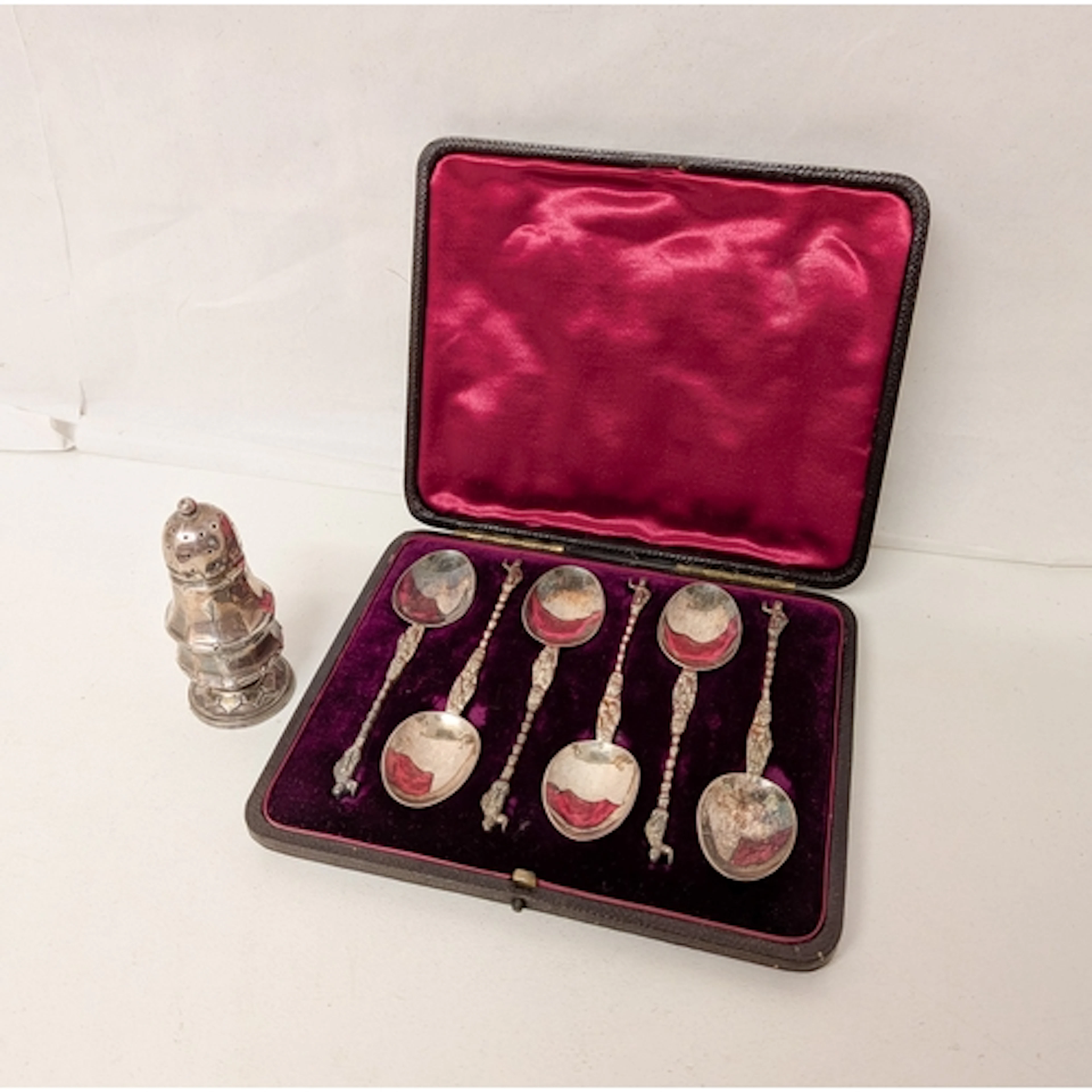 A cased set of six hallmarked silver Apostle coffee spoons a...