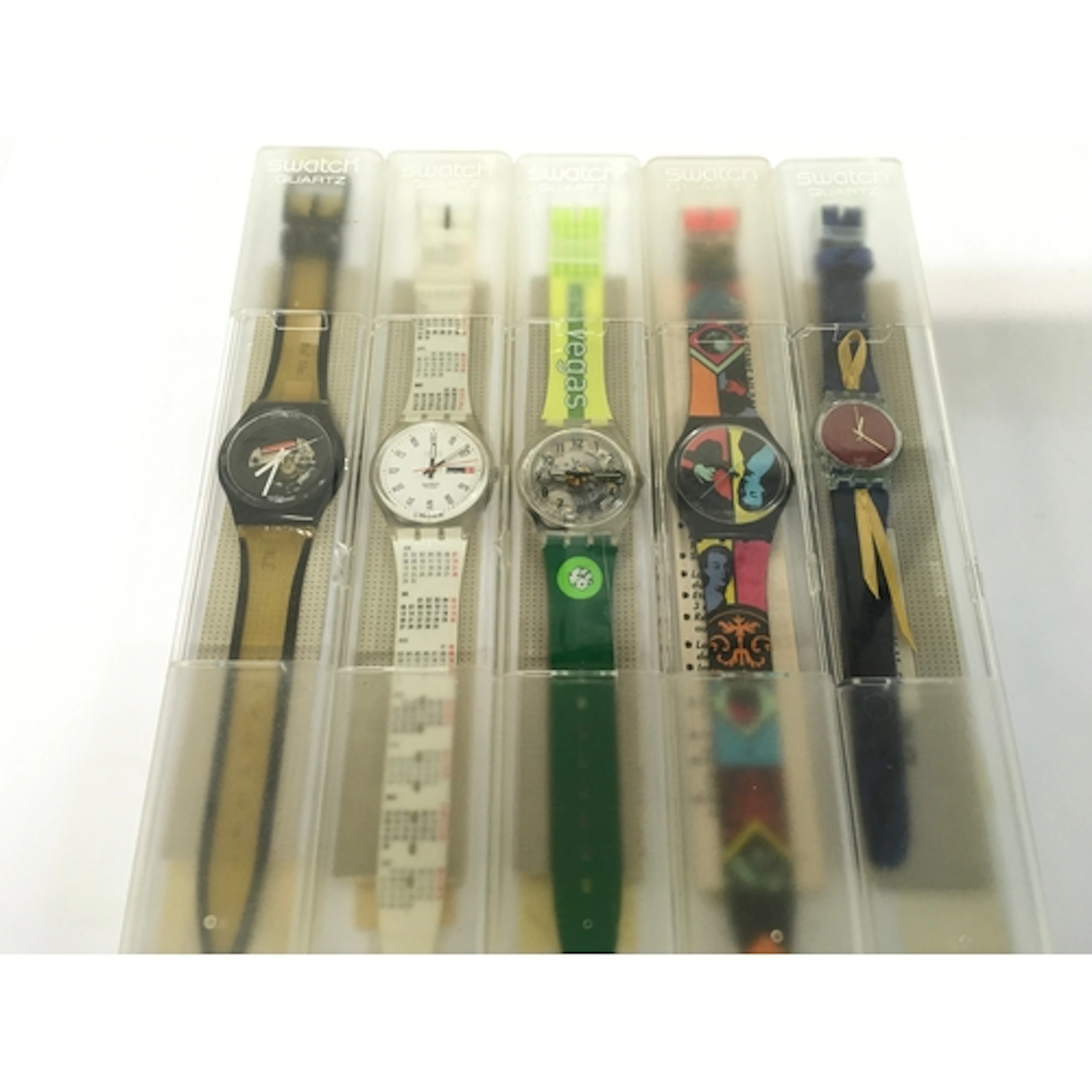 collection features various vintage Swatch Gent watches from...