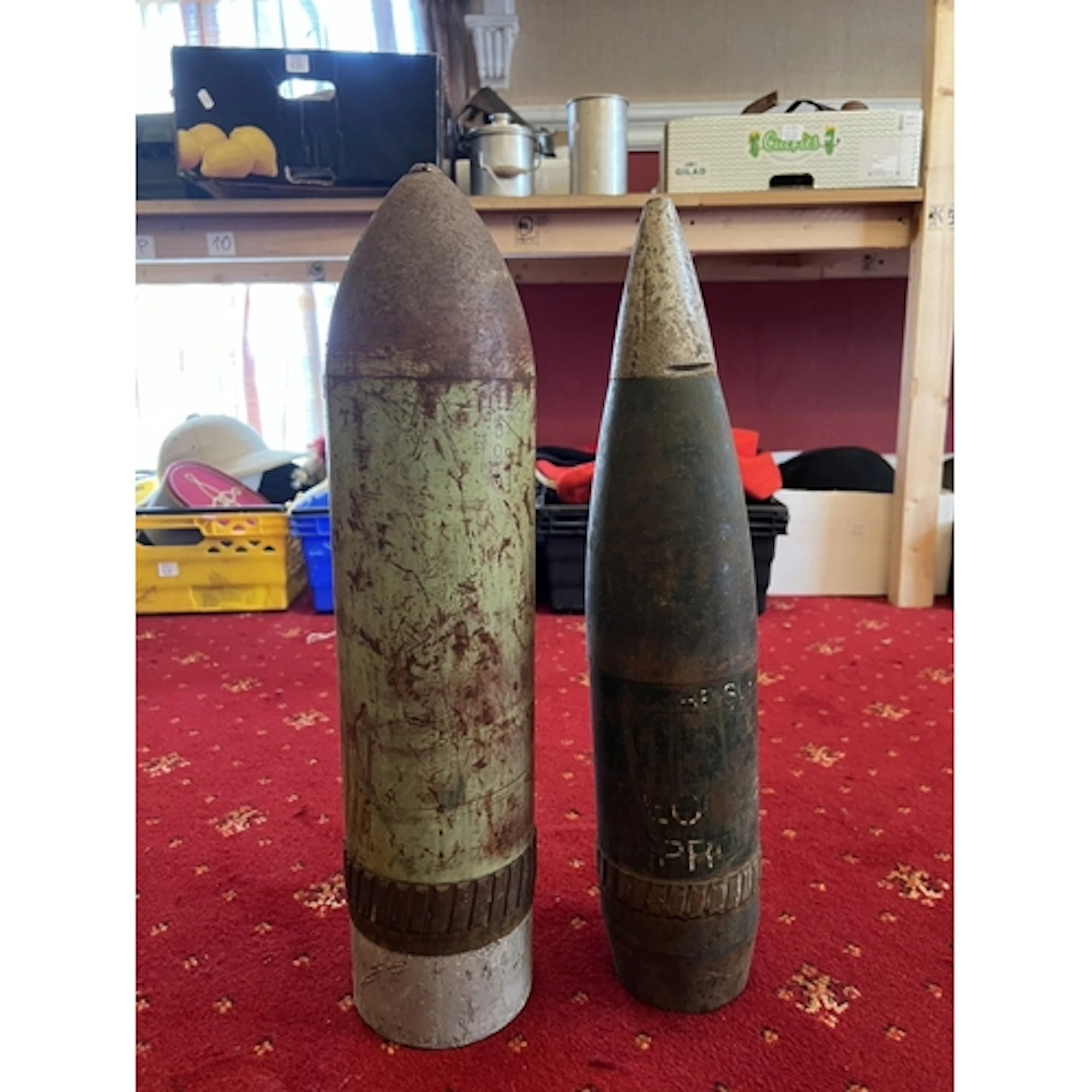 A LARGE INERT MISSILE AND A LARGE INERT BOMB, both still hav...