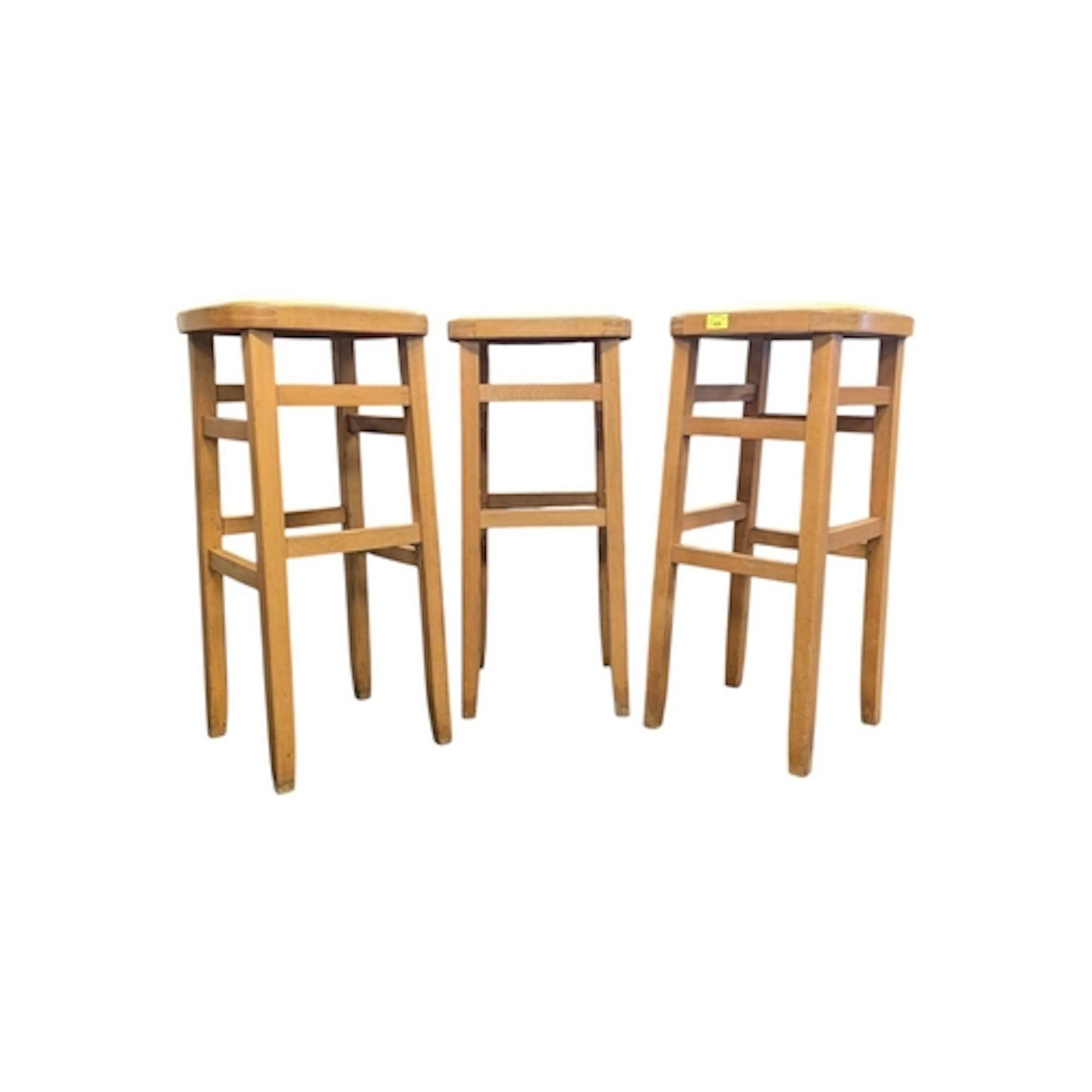 A set of three Ben Chair style stools. Yellow padded top, re...