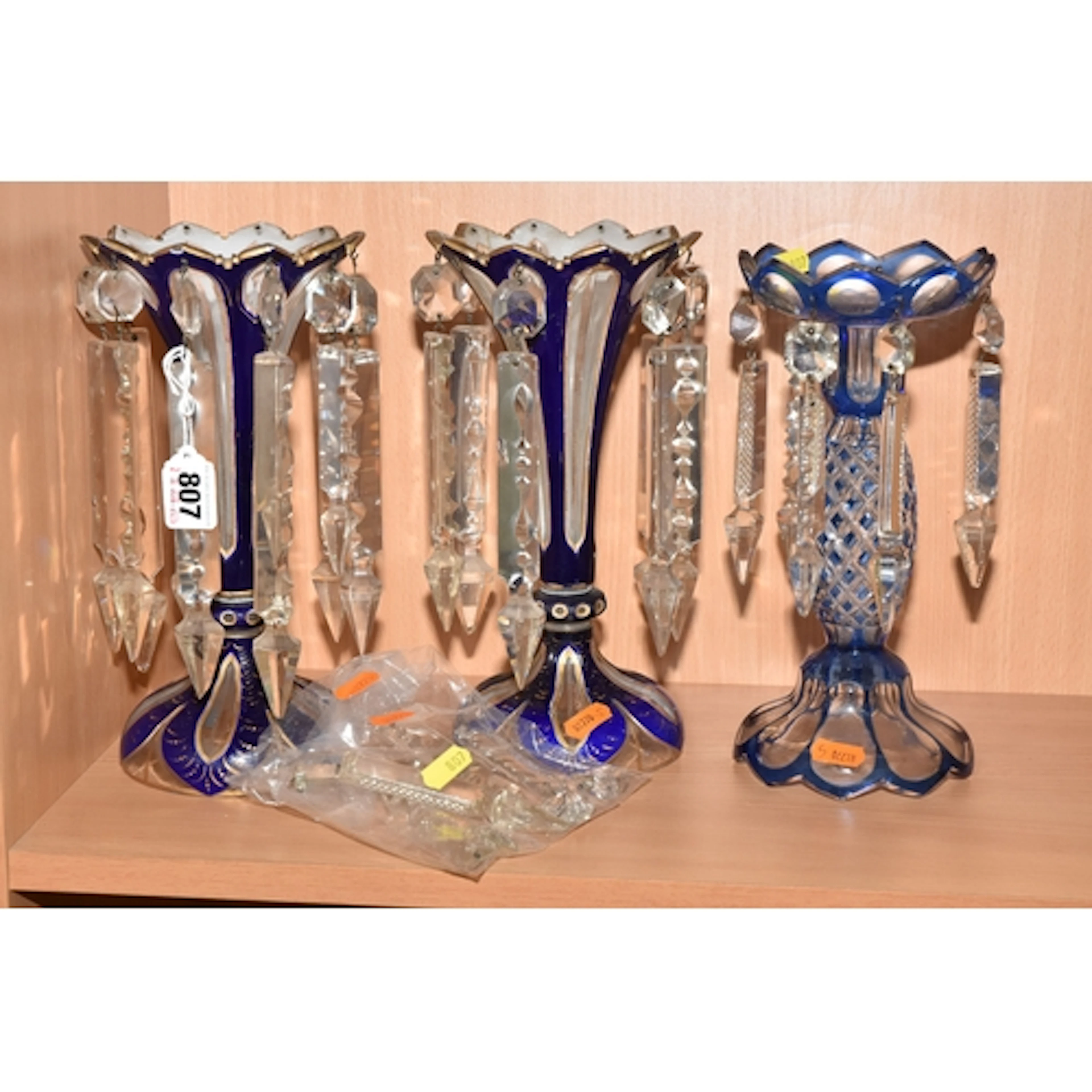 THREE GLASS LUSTRES, comprising a pair of clear and blue lus...