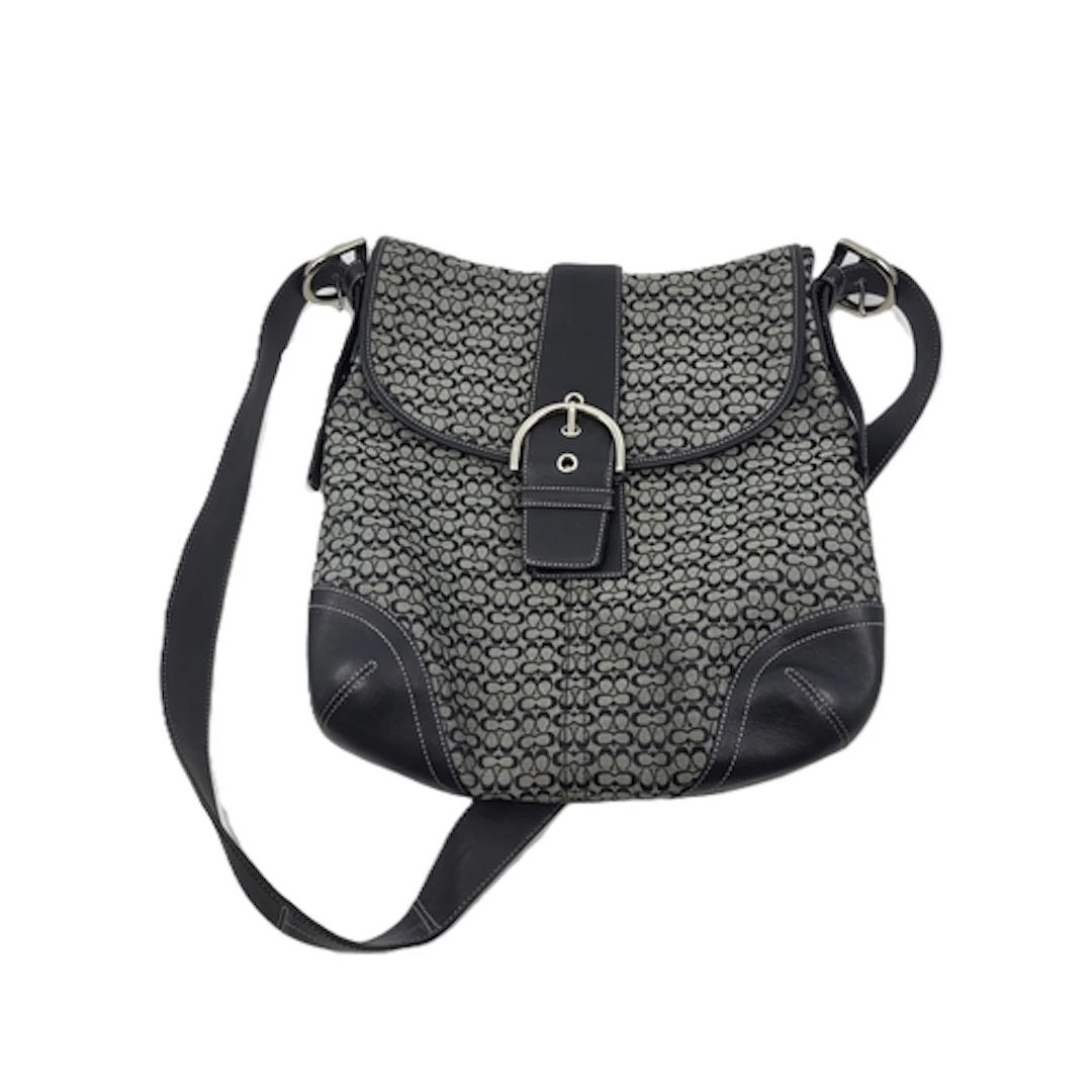 A COACH HANDBAG, monogram canvas, with black leather accents...