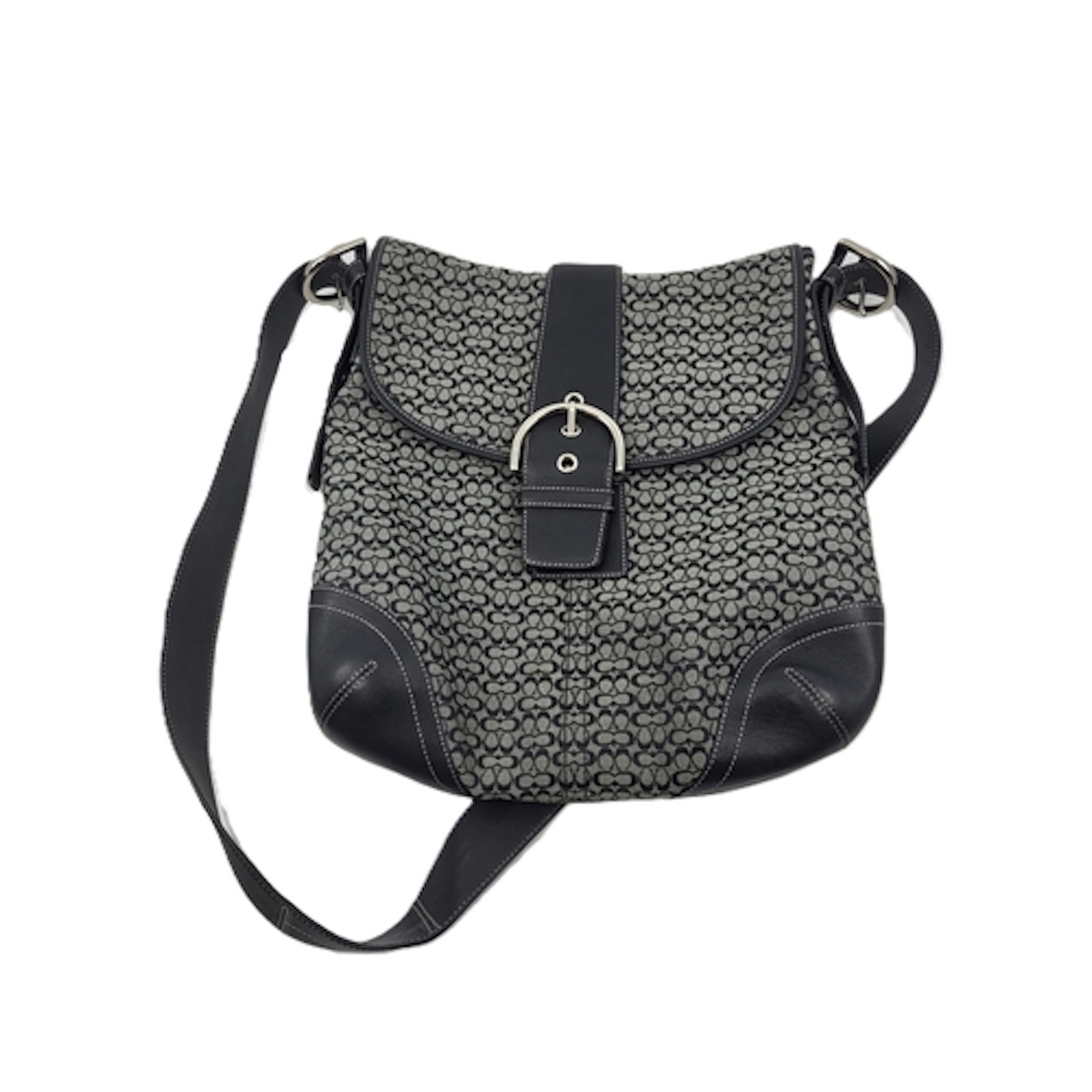 A COACH HANDBAG, monogram canvas, with black leather accents...