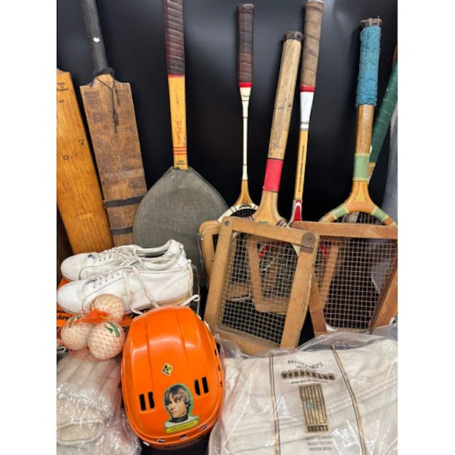 Two cricket bats, a pair of shoes, tennis racquets, squash r...