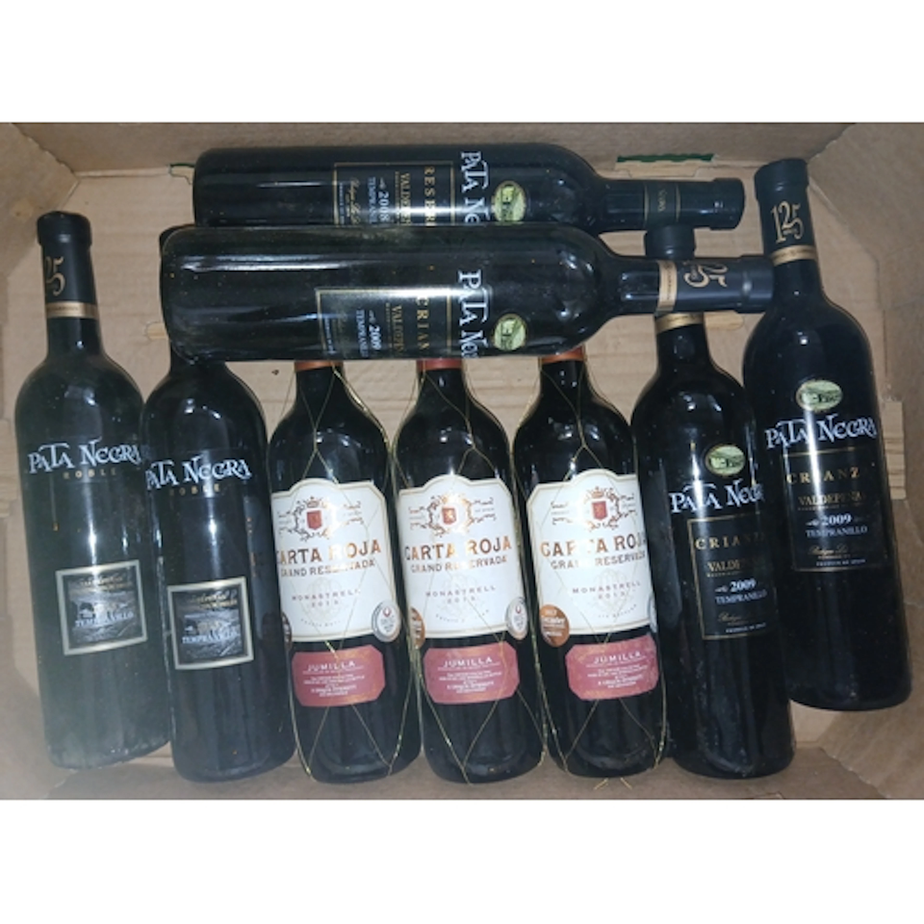 Four boxes of assorted red wines.