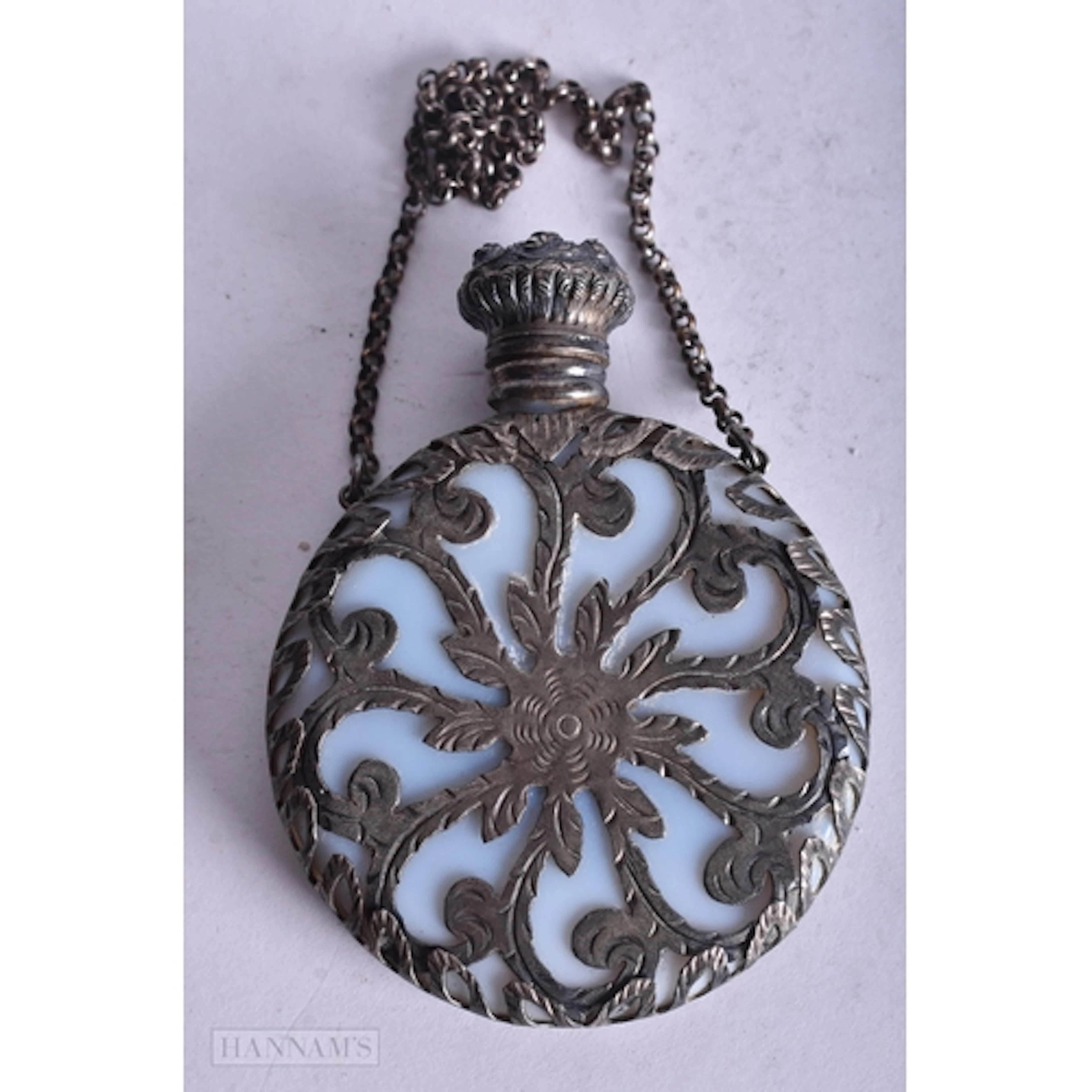 AN ART NOUVEAU SILVER OVERLAID OPALESCENT GLASS SCENT BOTTLE...