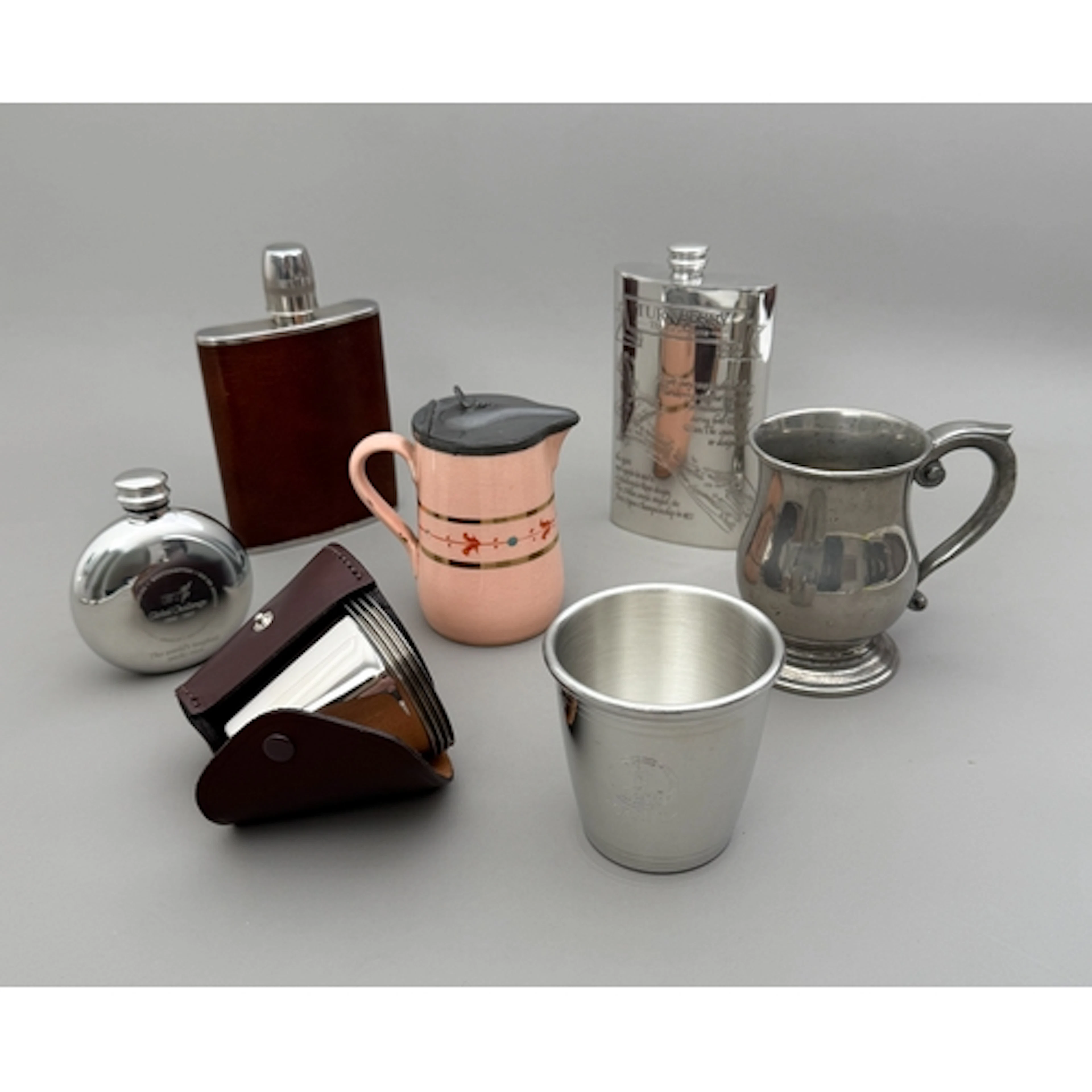 A group of pewter ware - comprising a leather cased set of f...