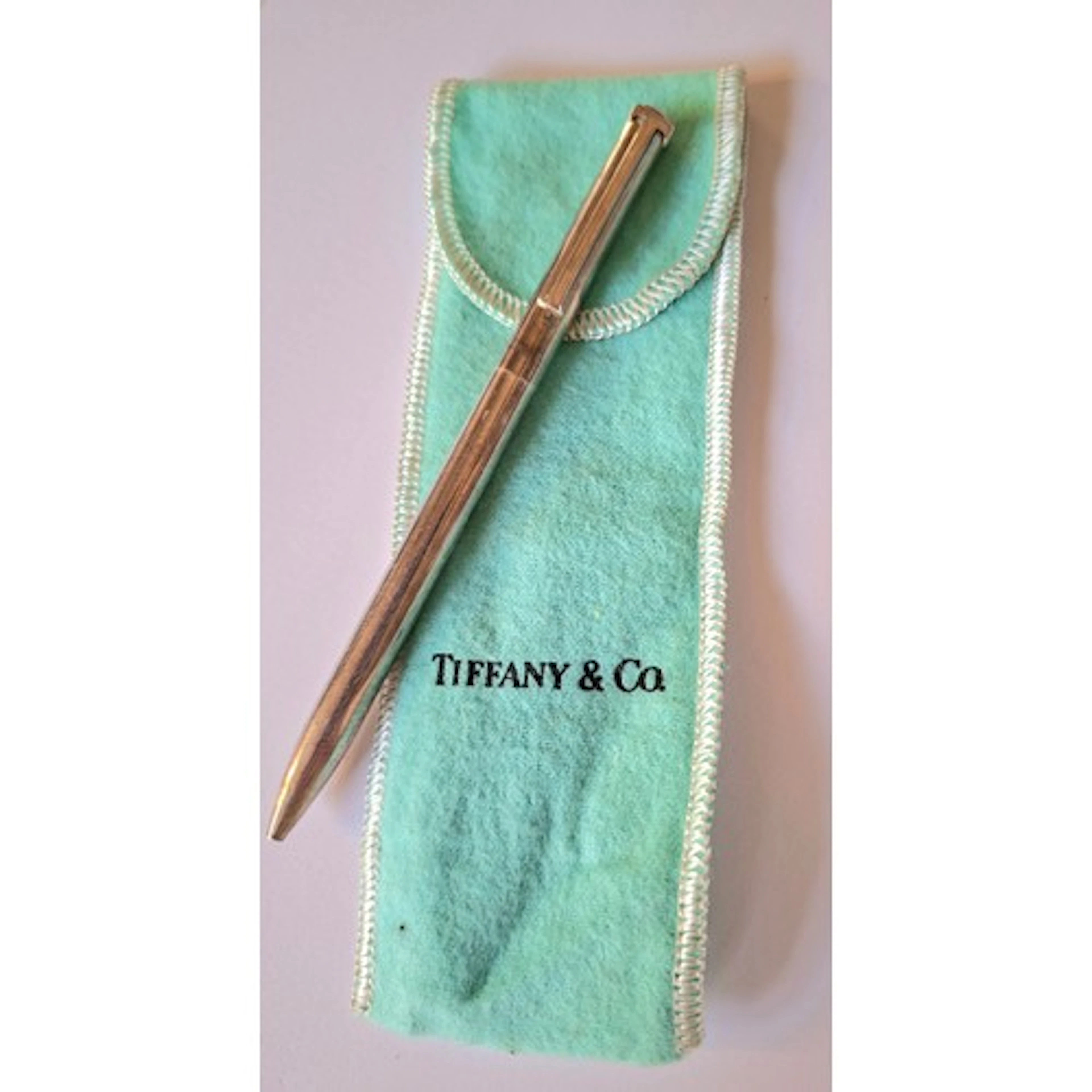 Tiffany & Co- A silver ballpoint pen inscribed 'DR' having a...
