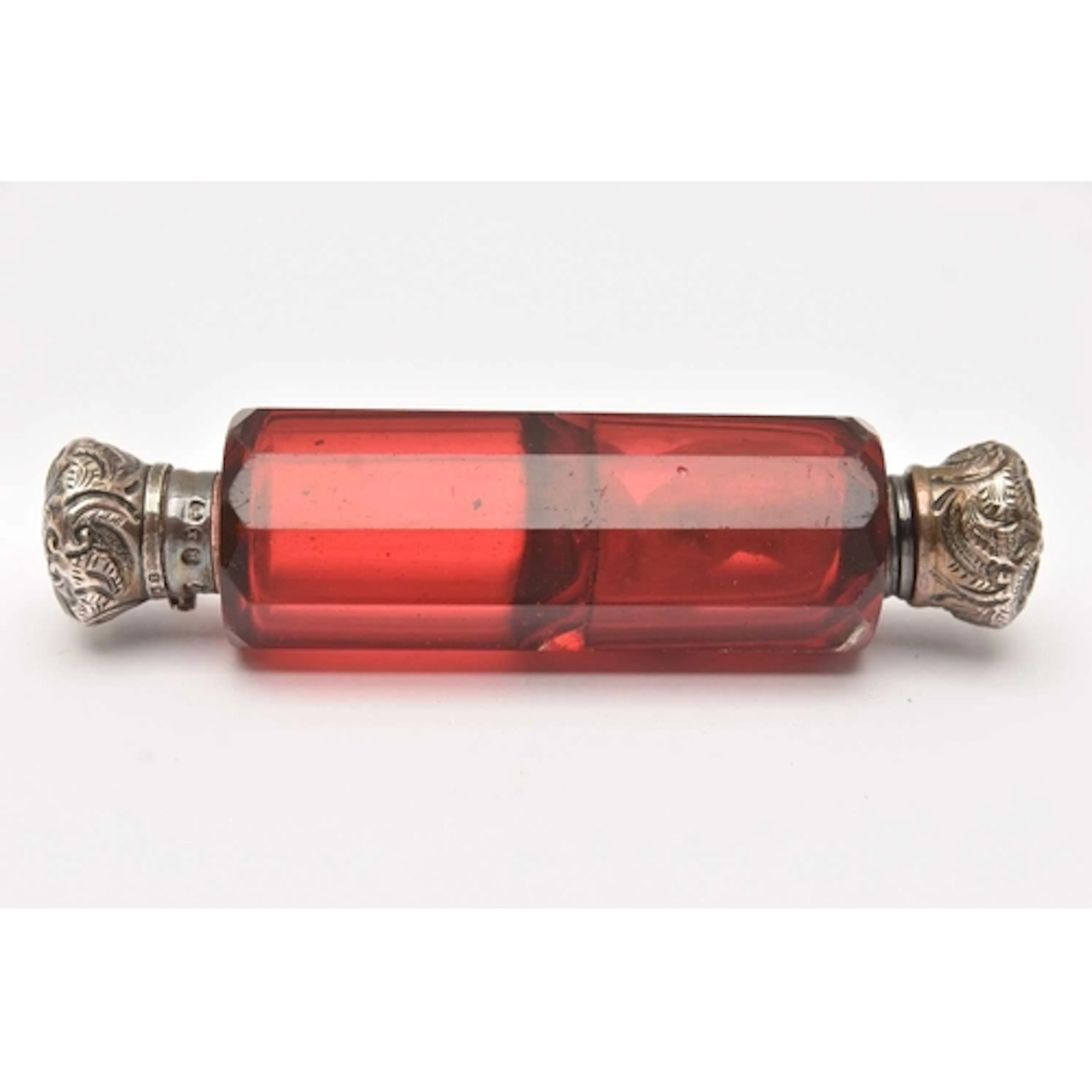 A LATE VICTORIAN DOUBLE ENDEND SCENT BOTTLE, a cranberry gla...