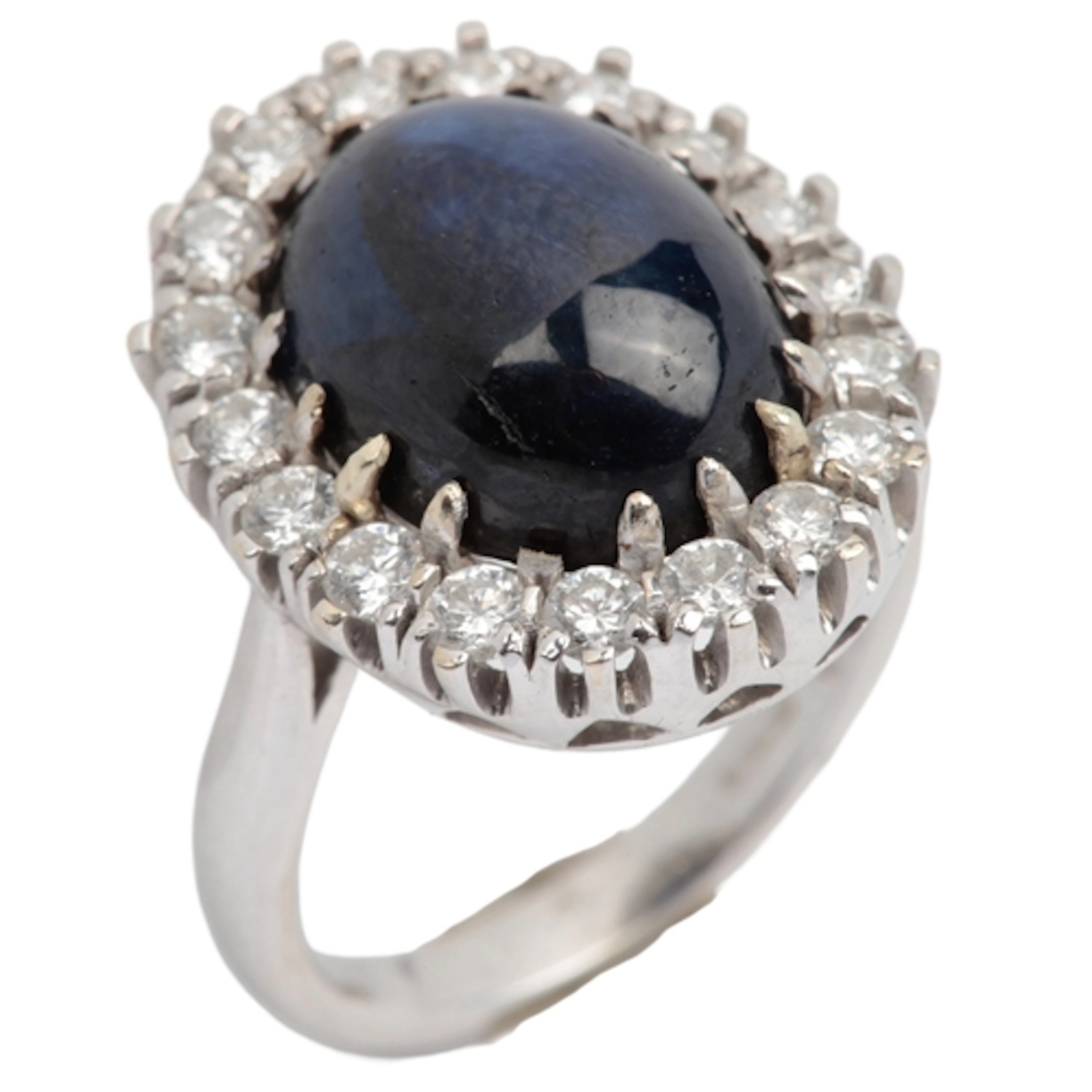 A treated sapphire and diamond ring, claw-set with a colour-...