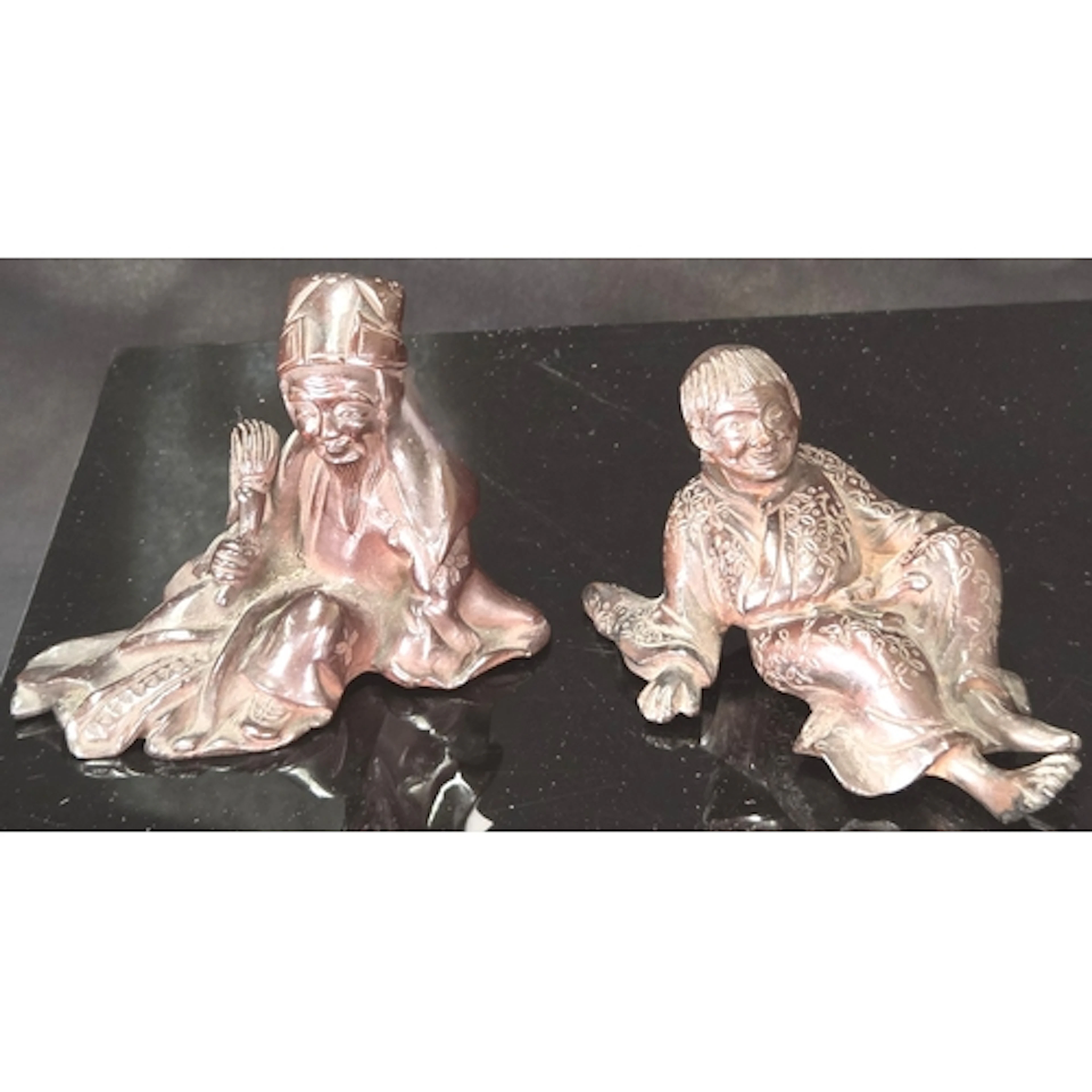 Two 19th century Chinese miniature bronze figures, a reclini...