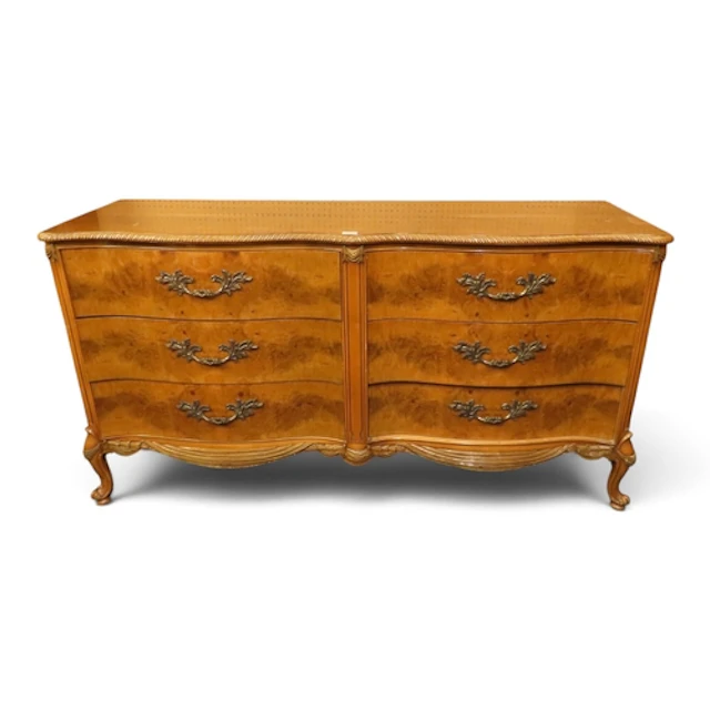 A large 20th century burr walnut veneered serpentine front b...