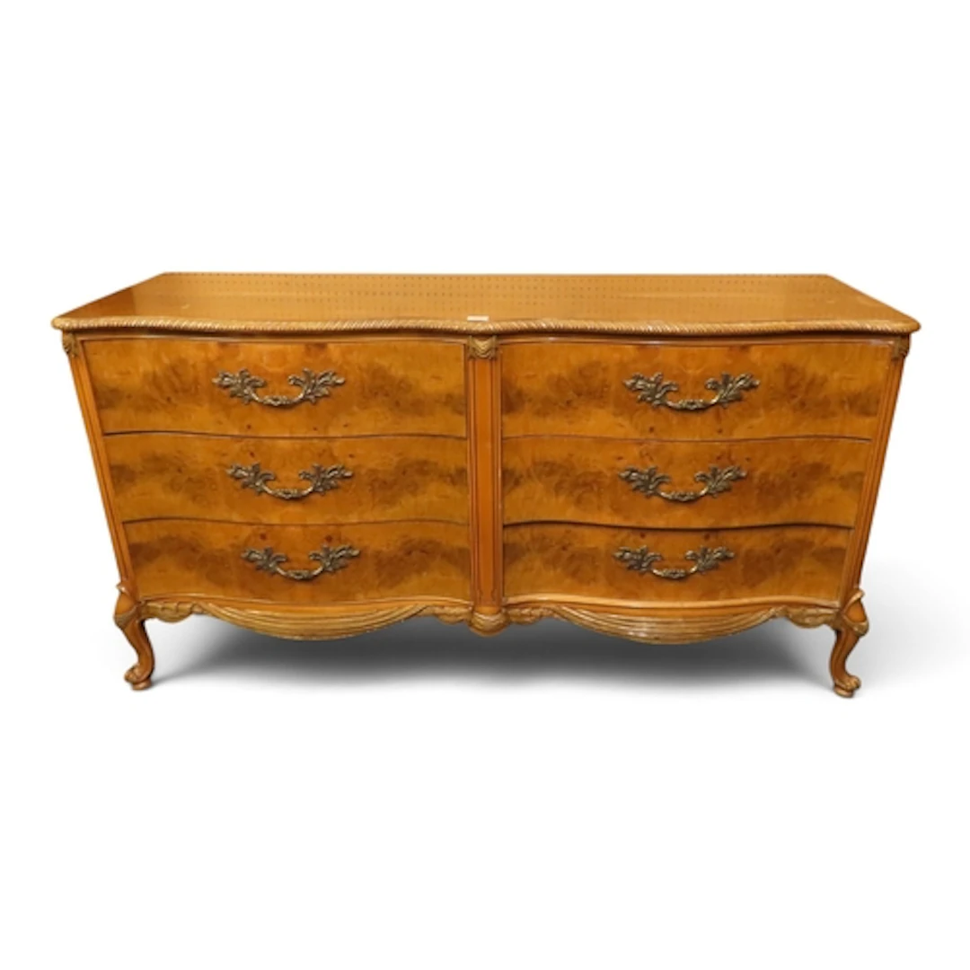 A large 20th century burr walnut veneered serpentine front b...