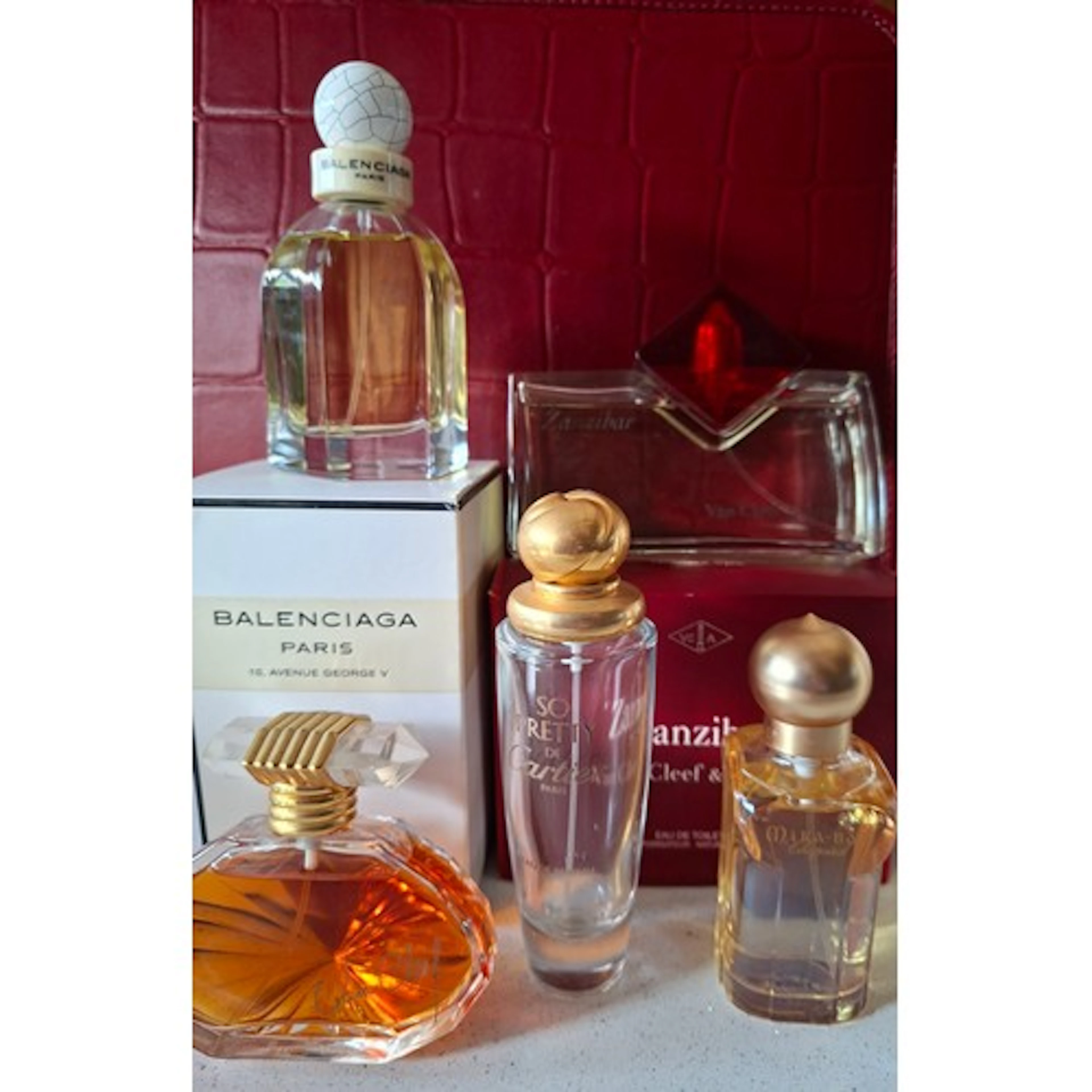 Four fragrances, all nearly full, comprising Van Cleefs & Ar...