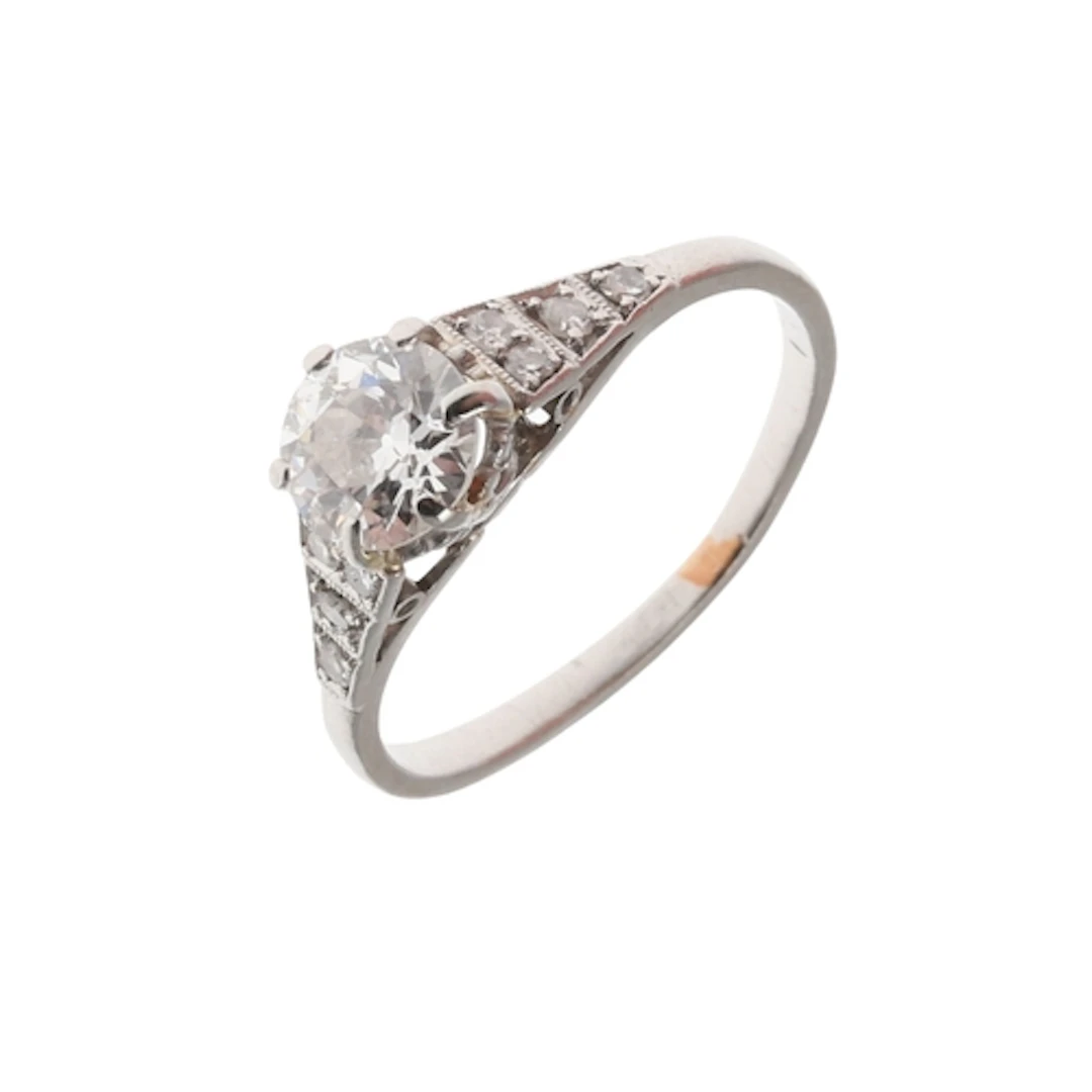 A DIAMOND SOLITAIRE RING. the circular old-cut diamond weigh...
