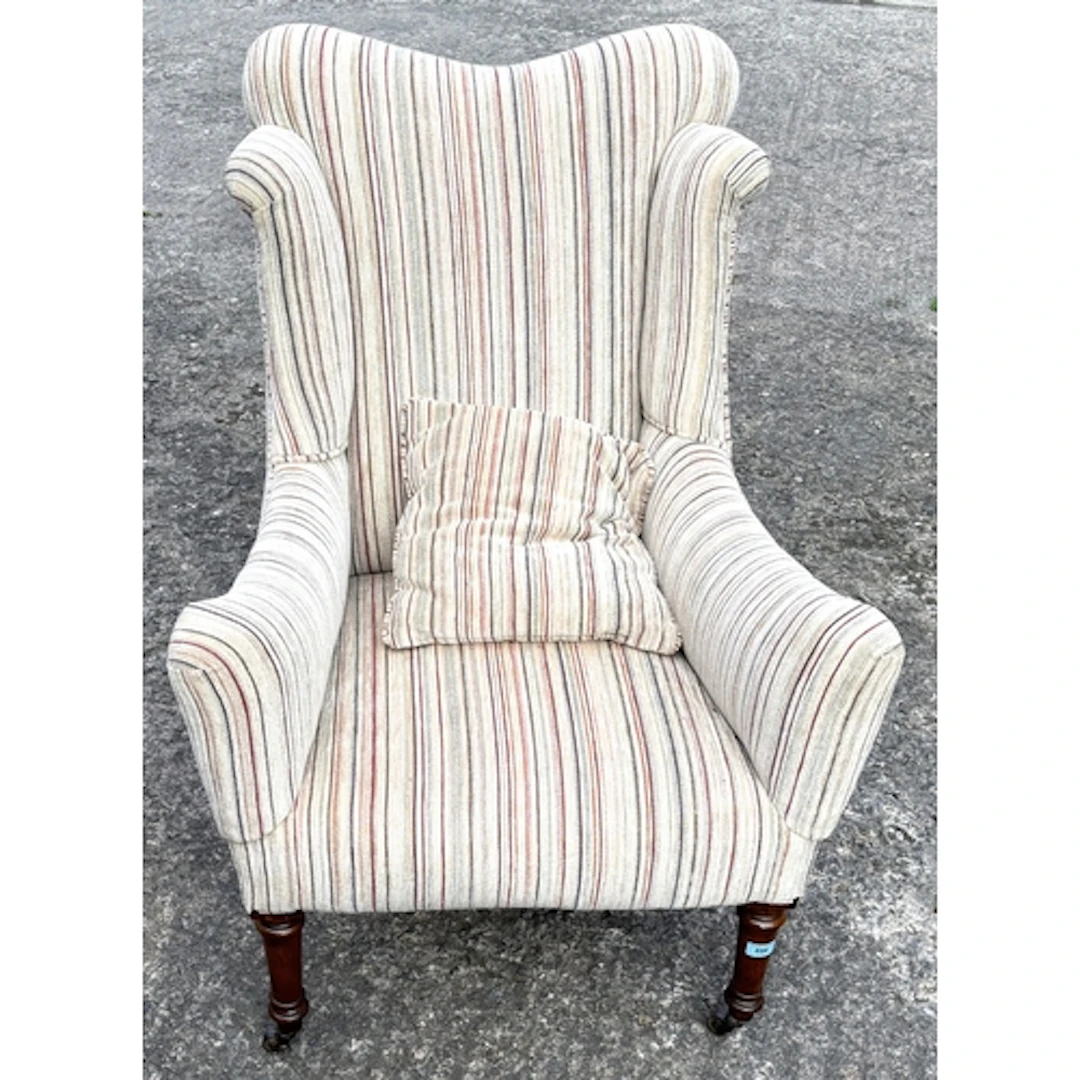 1920's re-upholstered wing back armchair on turned mahogany ...
