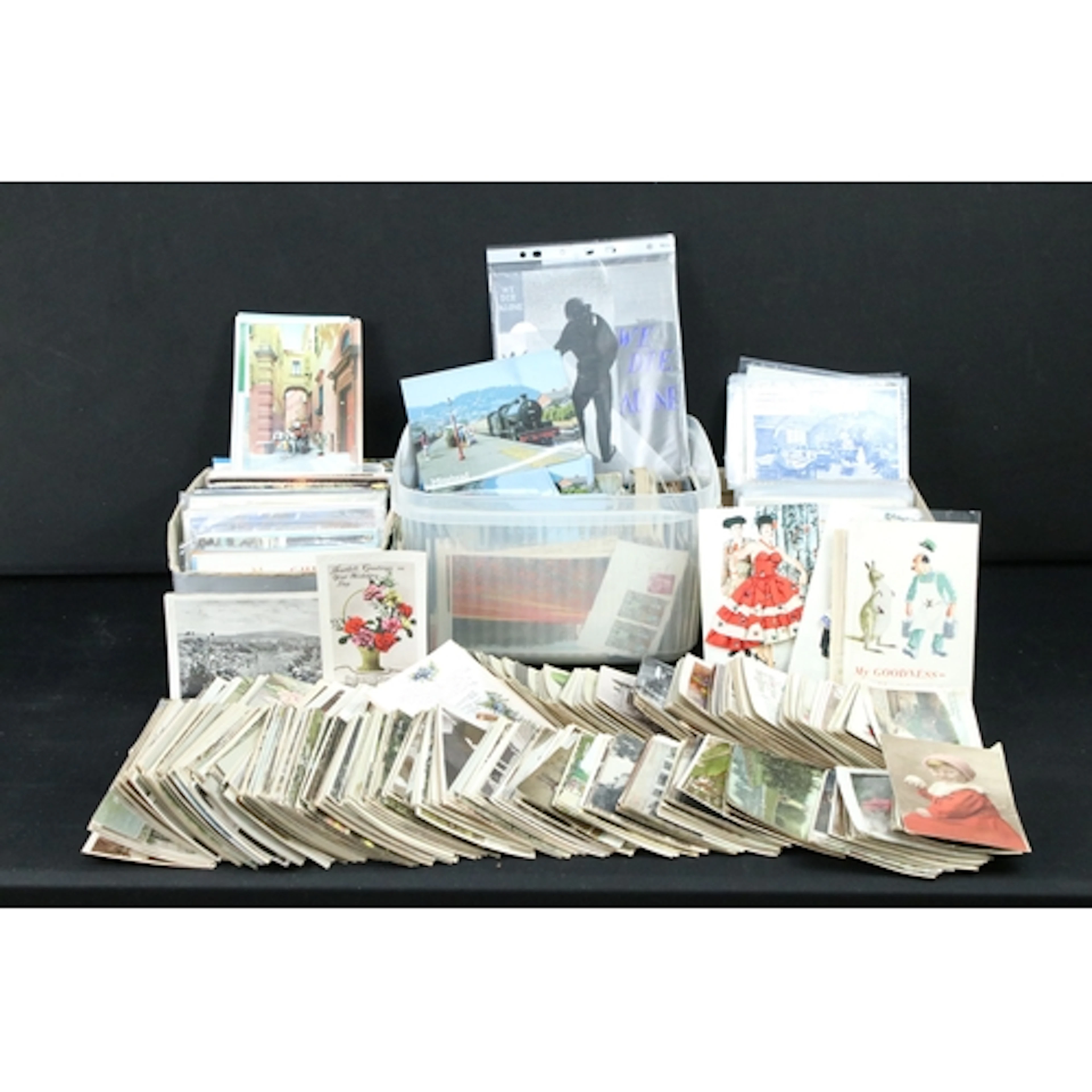 A collection of early to mid 20th century postcards, real ph...