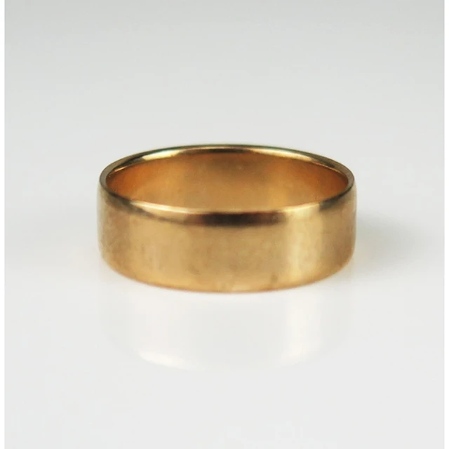A 9ct gold plain wedding band, 5.76mm wide size L.75, hallma...
