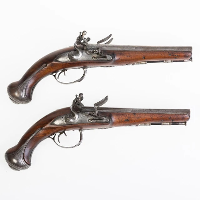 A CASED PAIR OF FRENCH 25 BORE DOUBLE BARRELLED FLINTLOCK. A...