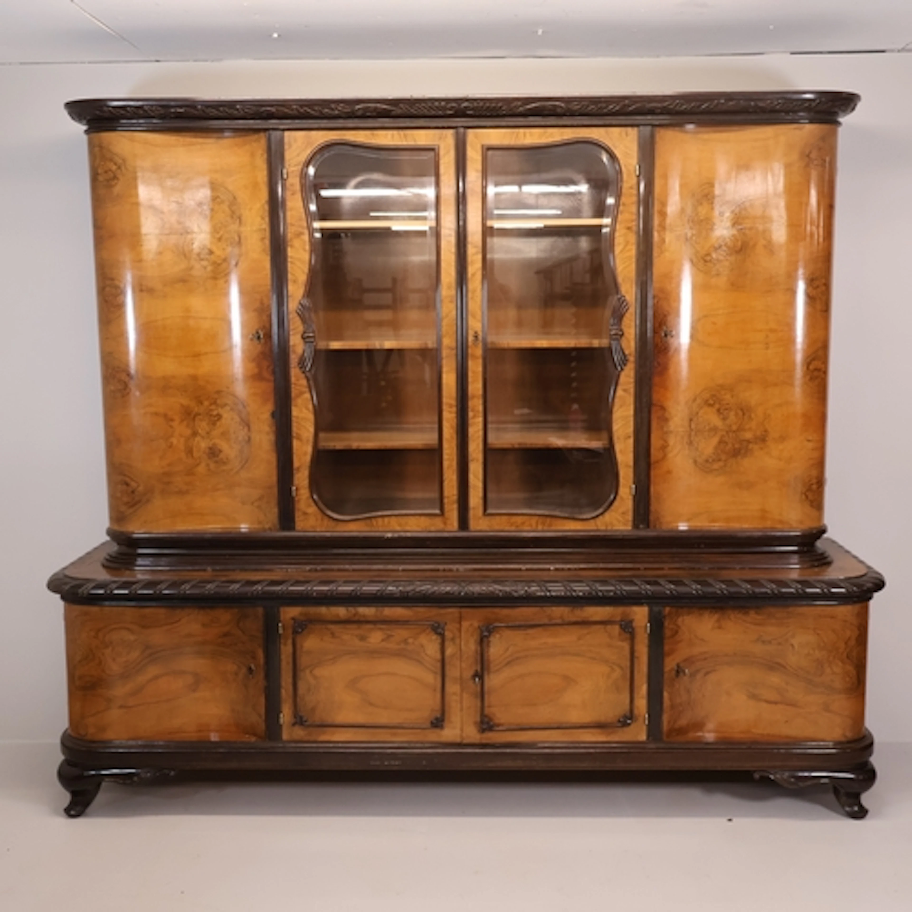 A German Biedermeier style oak and burr-walnut veneered two-...