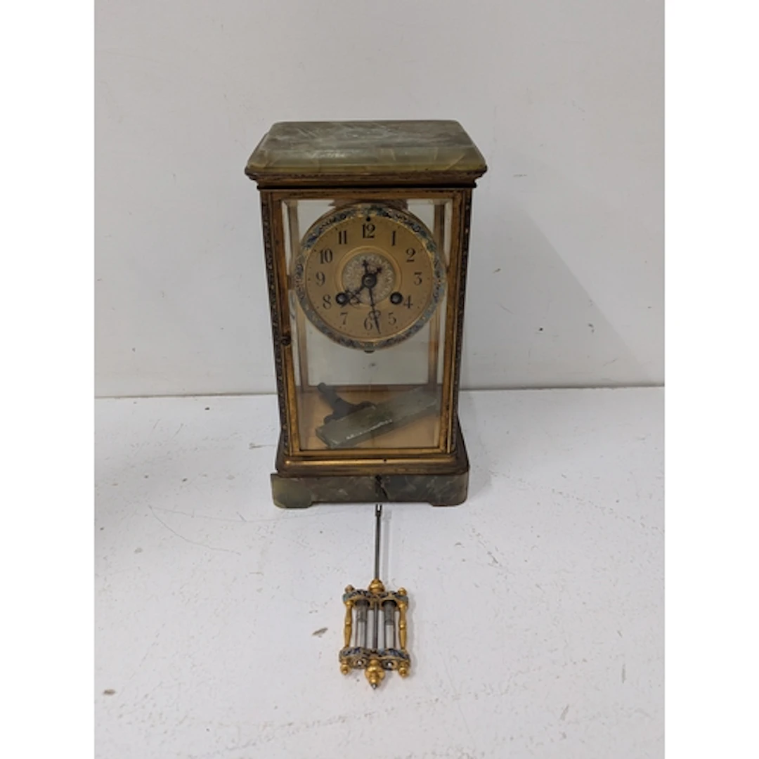 A circa 1900 French mantle clock with champleve enamel and m...