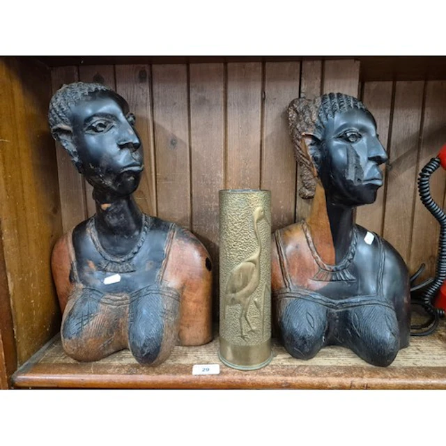 Two ethnic carved female figures (busts) together with a tre...