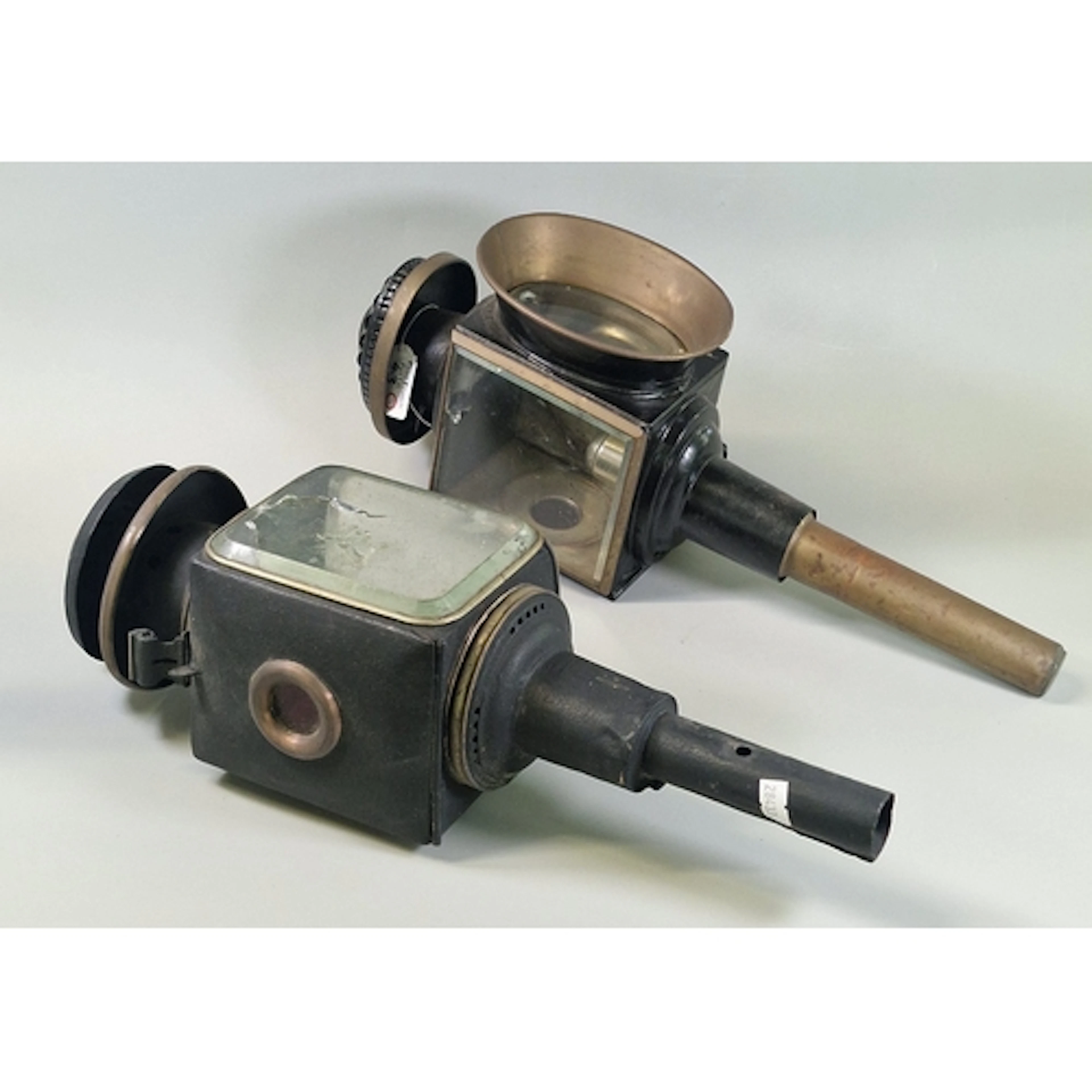 Two similar Victorian or Edwardian carriage lamps with brack...
