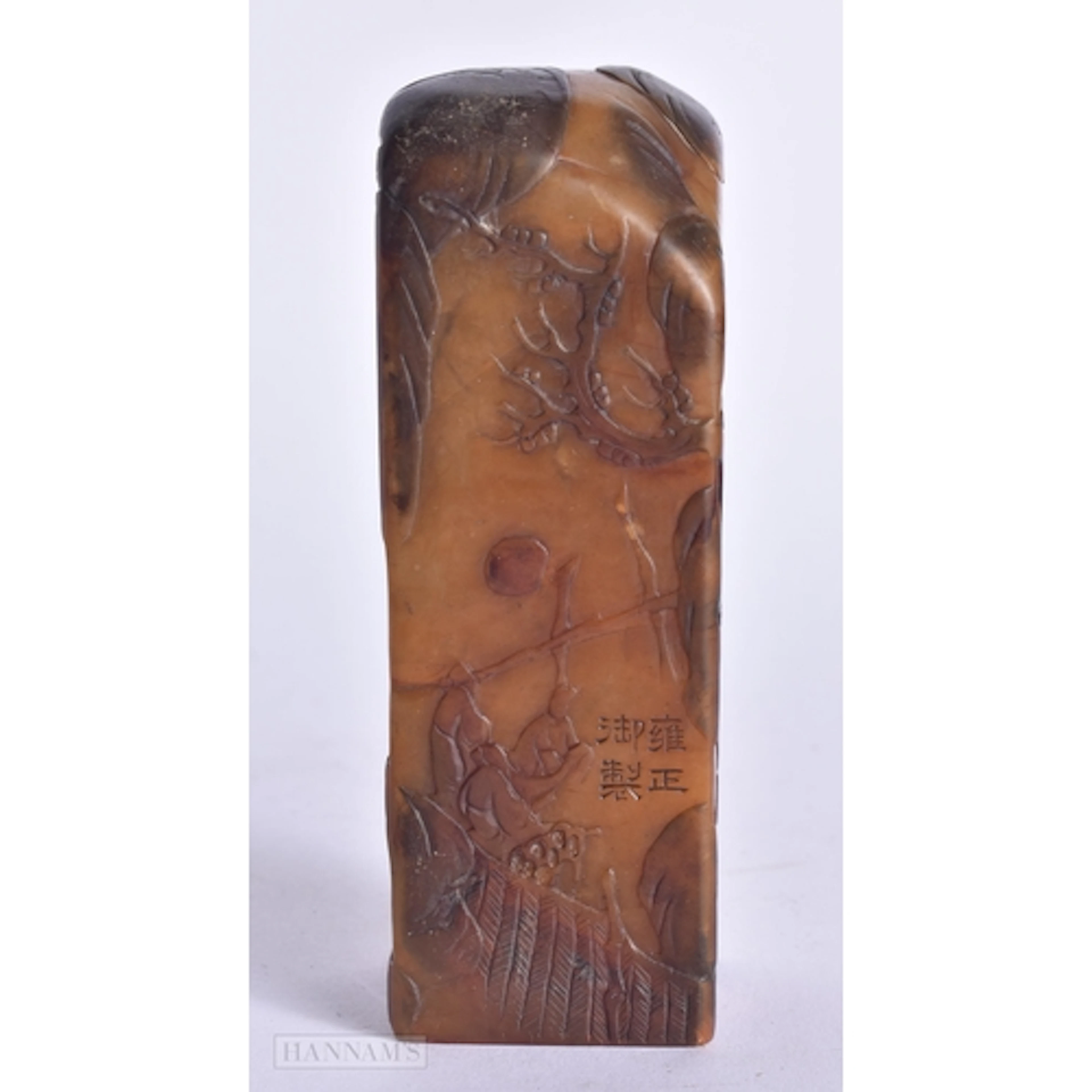 A CHINESE QING DYNASTY CARVED ORANGE STONE IMMORTAL LANDSCAP...
