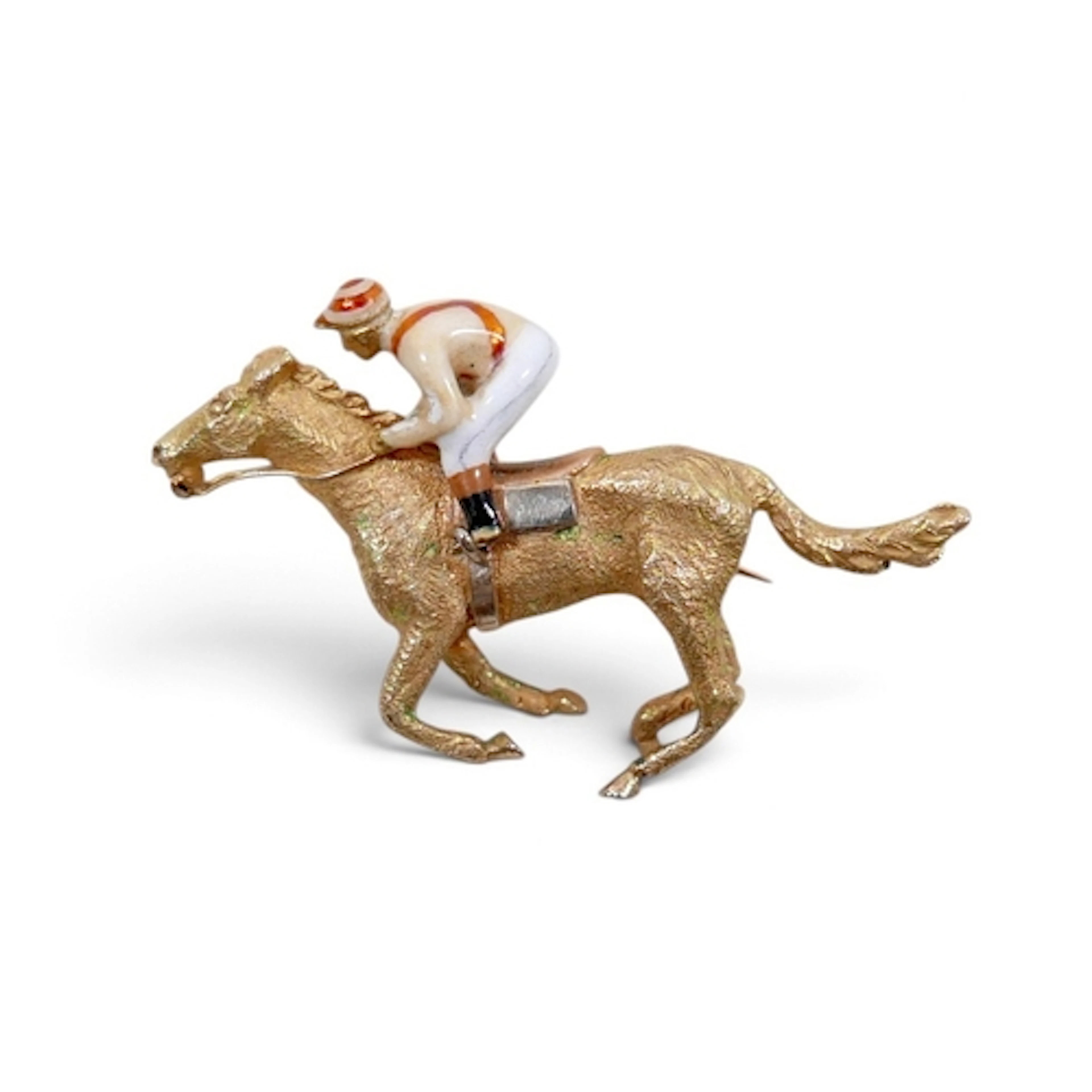 A 9CT GOLD HORSE RACING BROOCH. modelled as a mounted jockey...