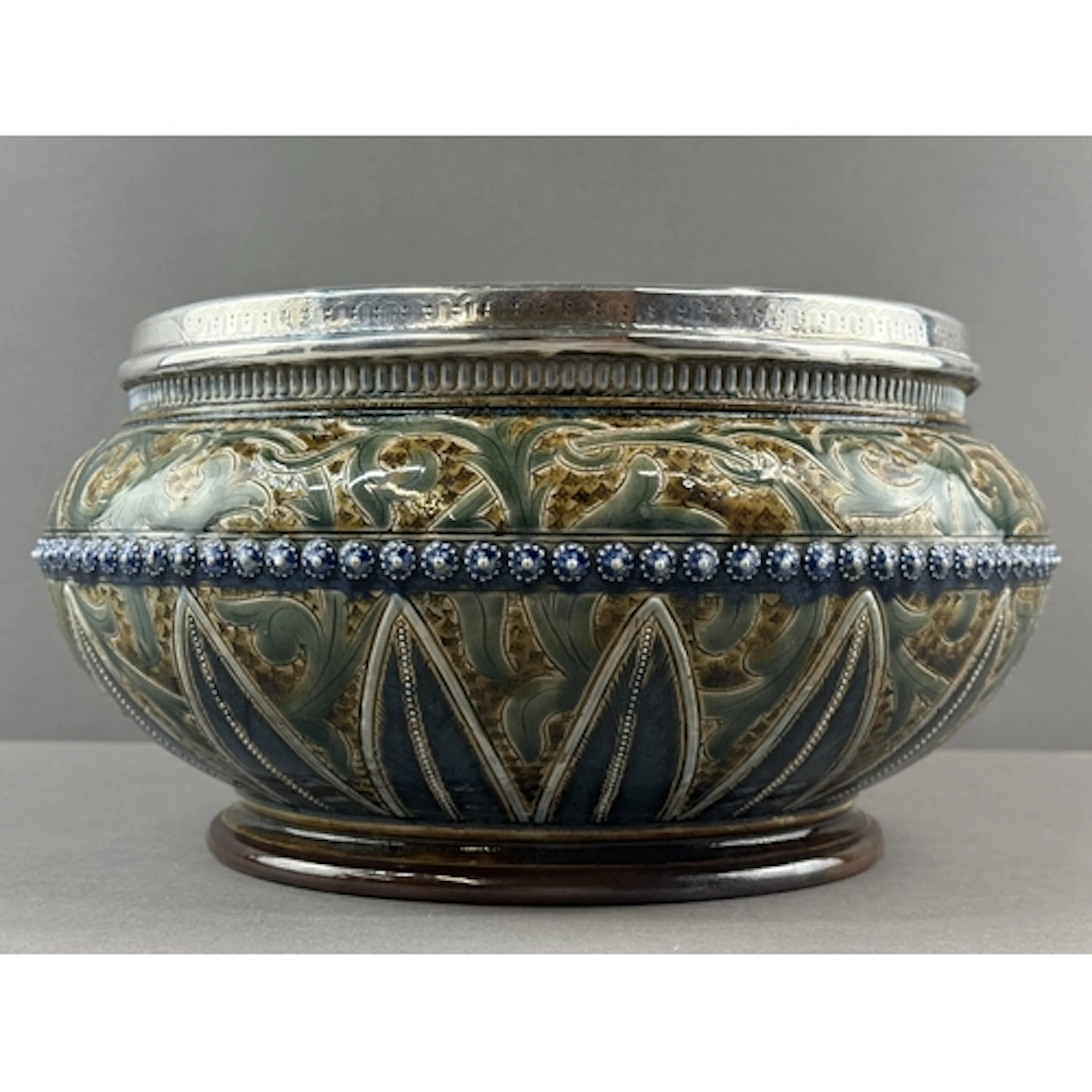 Ceramics: a Doulton Lambeth stoneware salad bowl with silver...