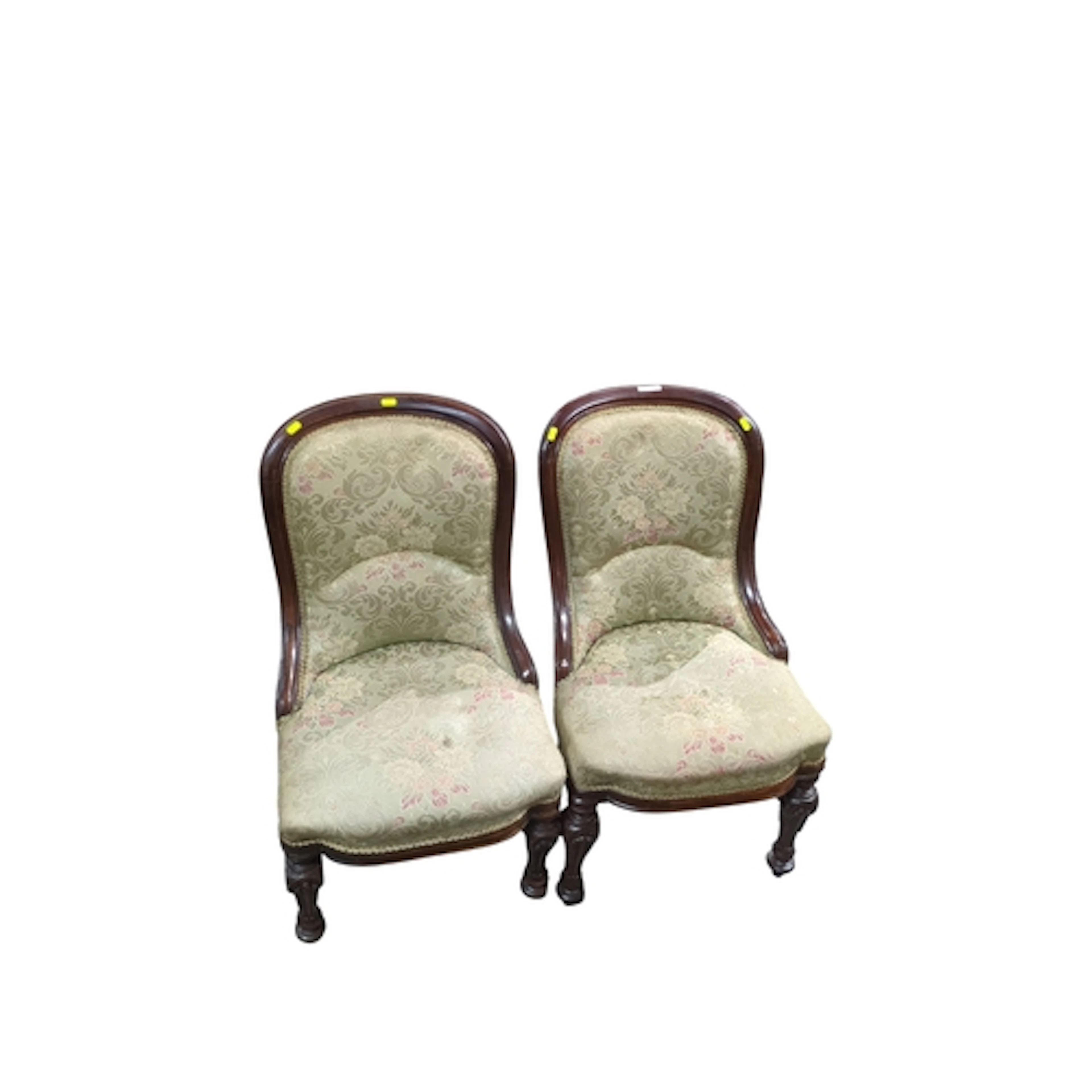 A pair of Victorian mahogany spoon-back armchairs, upholster...