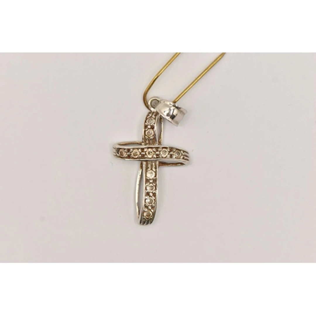 A 9CT WHITE GOLD CROSS PENDANT, a twisted style cross set wi...