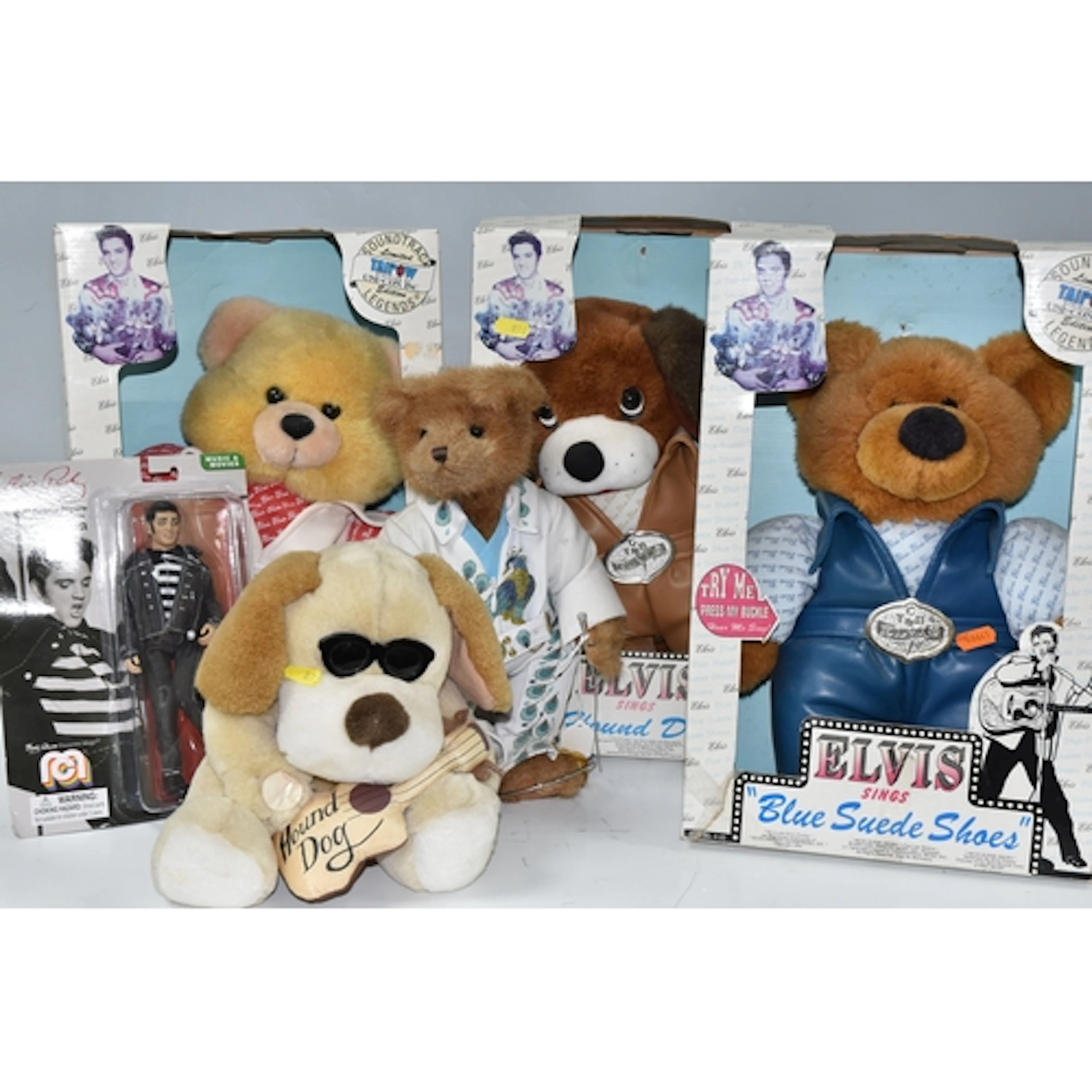 A GROUP OF FIVE ELVIS PRESELY RELATED PLUSH TOYS AND AN ACTI...