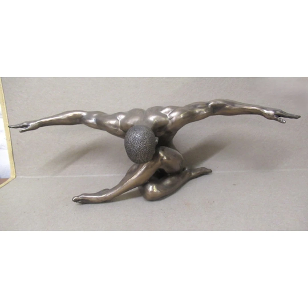 Bronzed composition of a seated figure with arms outstretche...