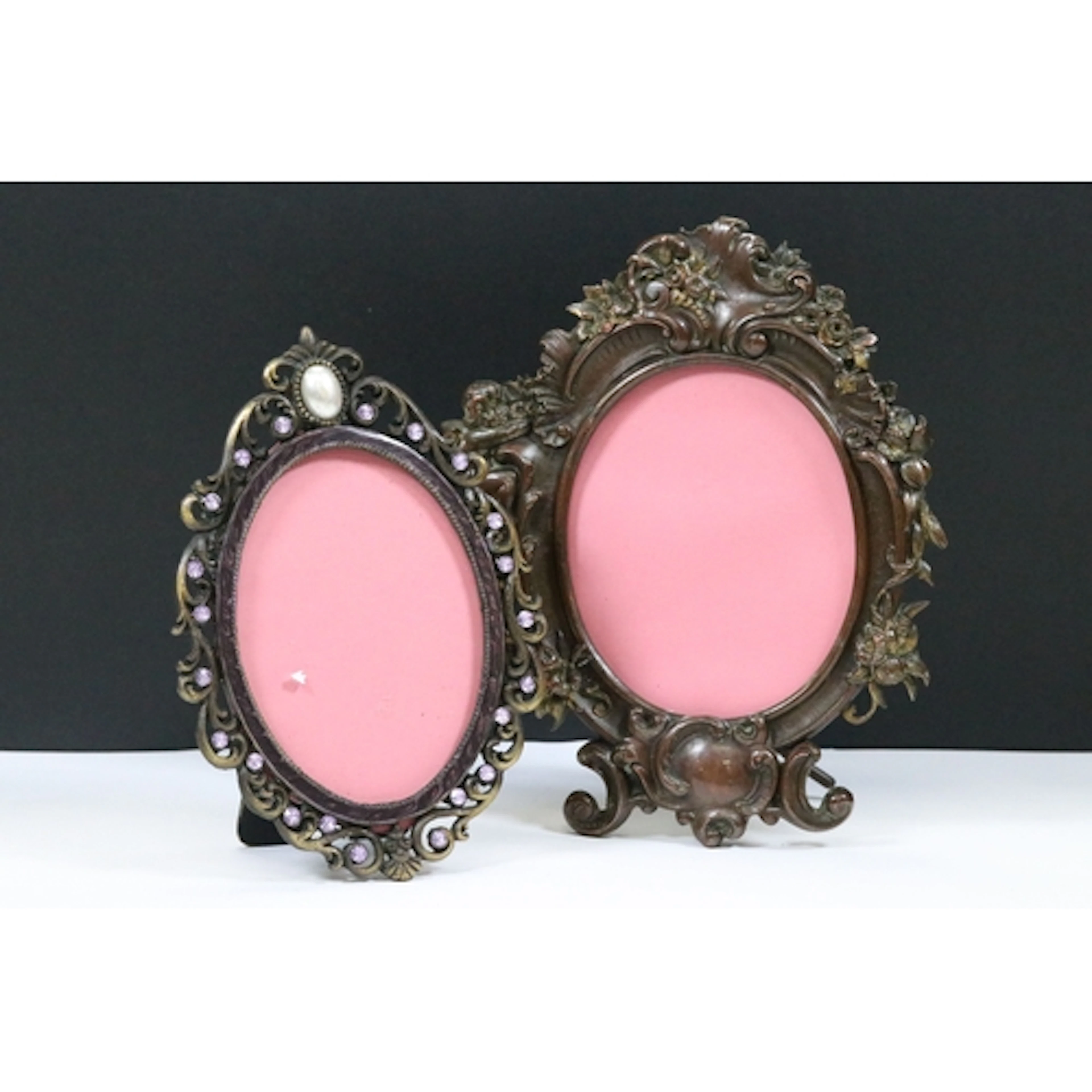 Two ornate easel back metal photo frames in Rococo style wit...