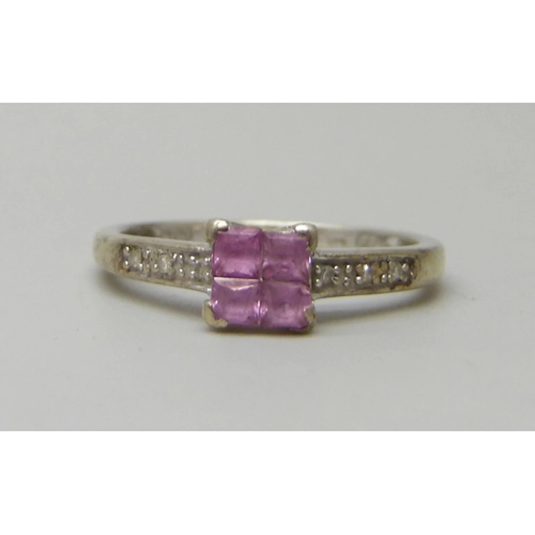 A 9ct white gold, diamond and pink stone ring, possibly pink...