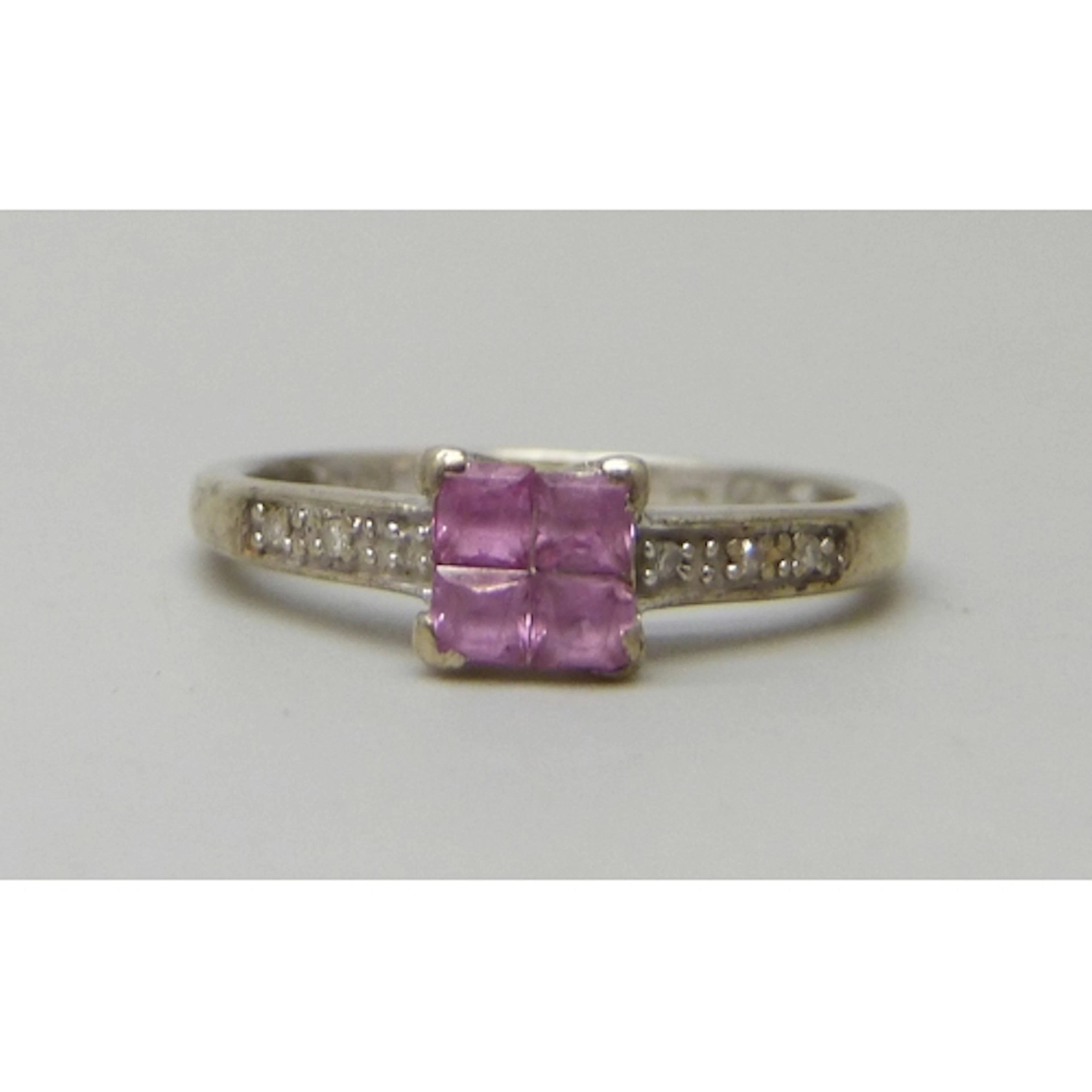 A 9ct white gold, diamond and pink stone ring, possibly pink...