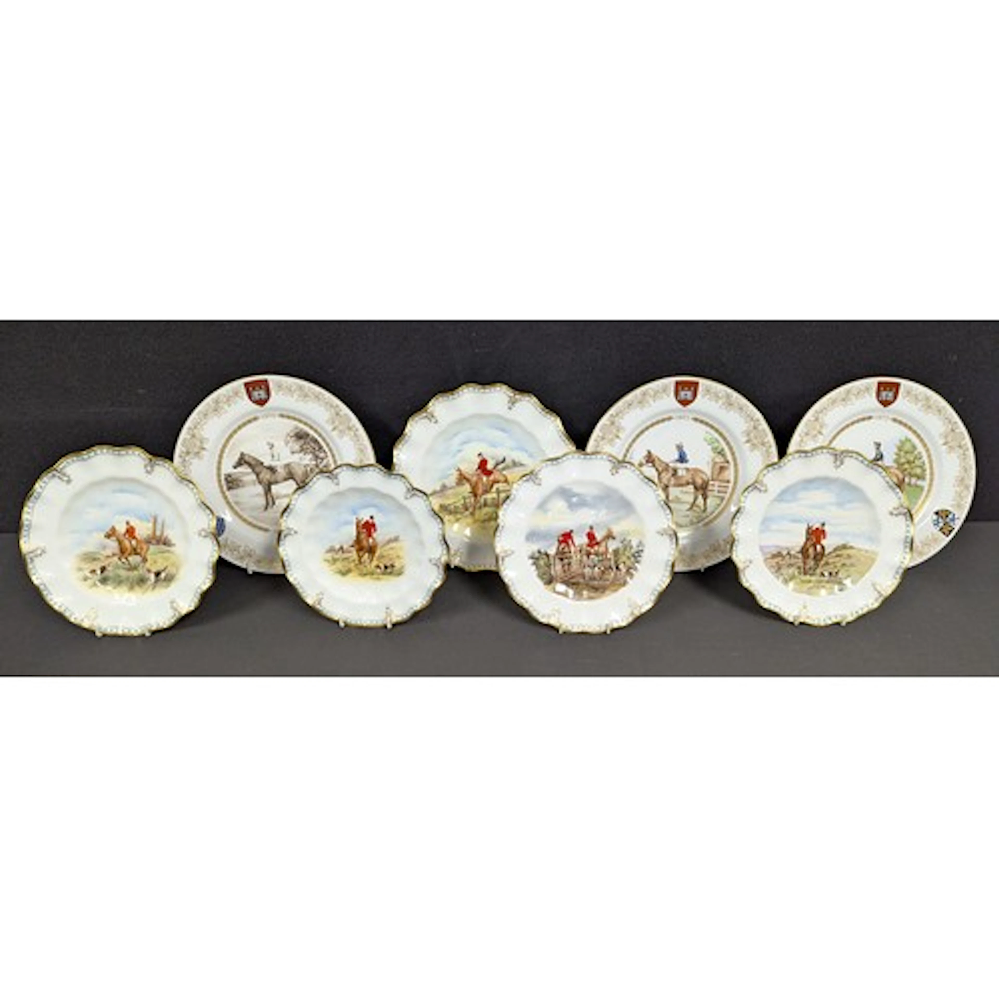 A Royal Crown Derby fluted circular plate, huntsman on horse...