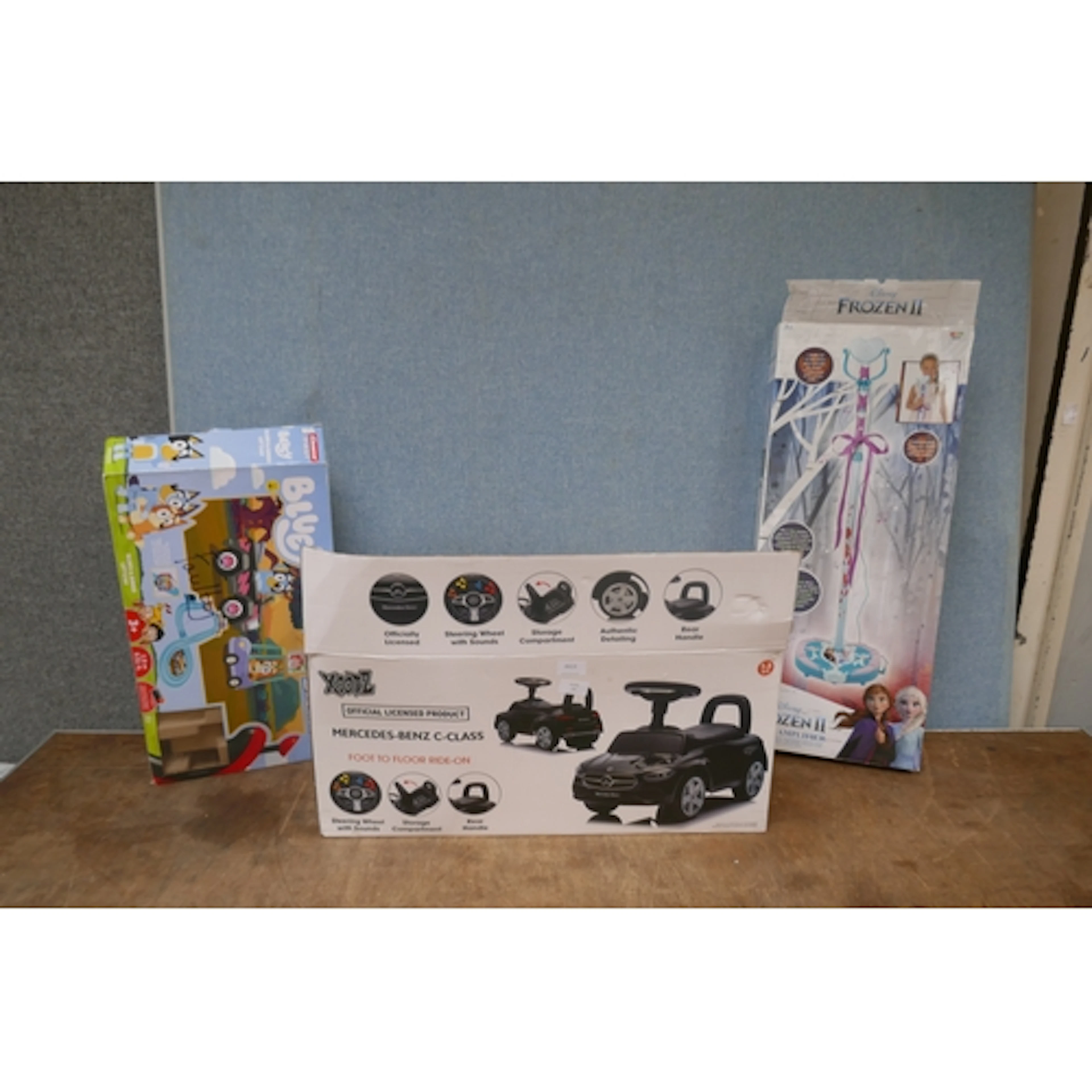 A Mercedes C-Class ride-on toy, Bluey game and a Frozen 2 mi...