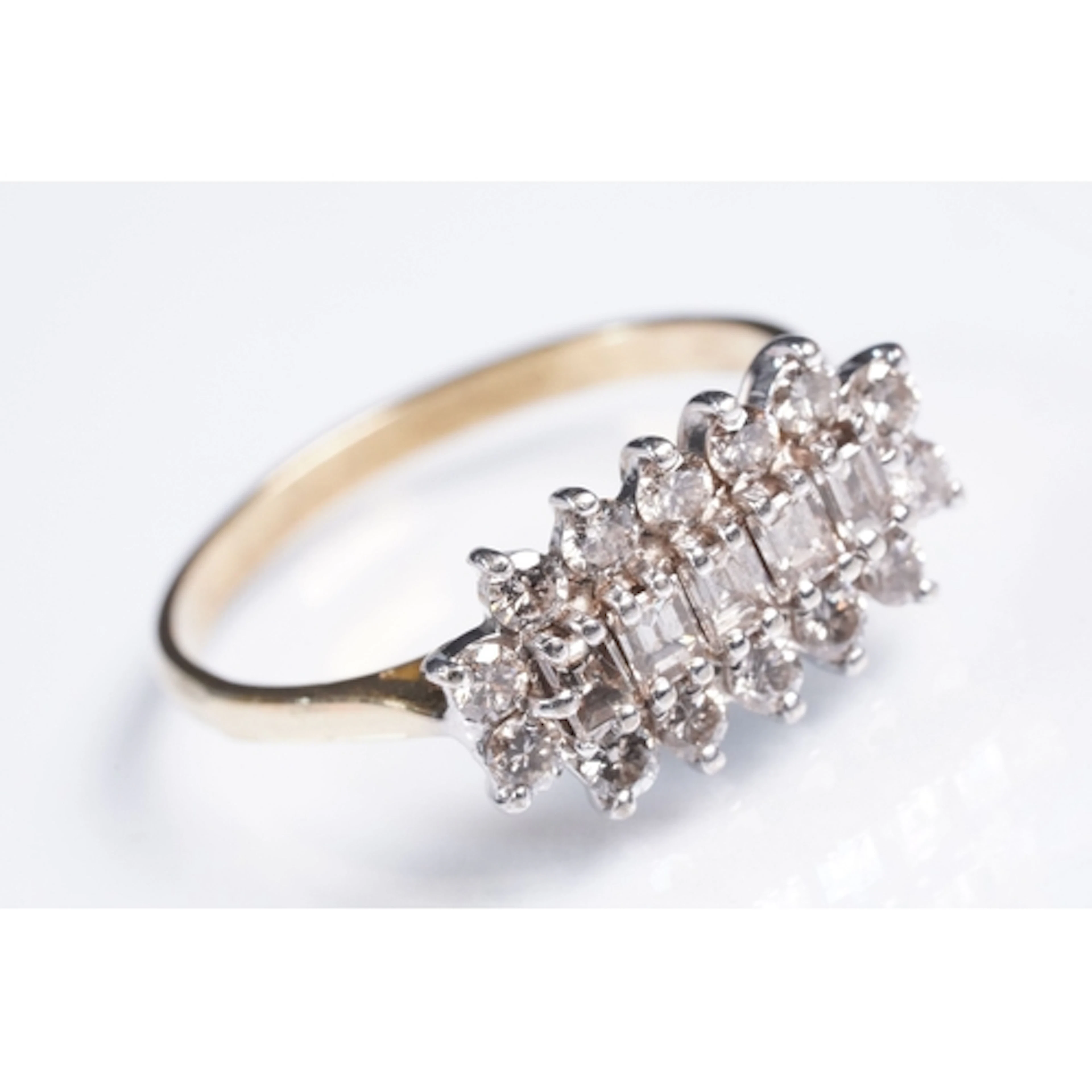 Diamond cluster ring being set with fourteen round brilliant...