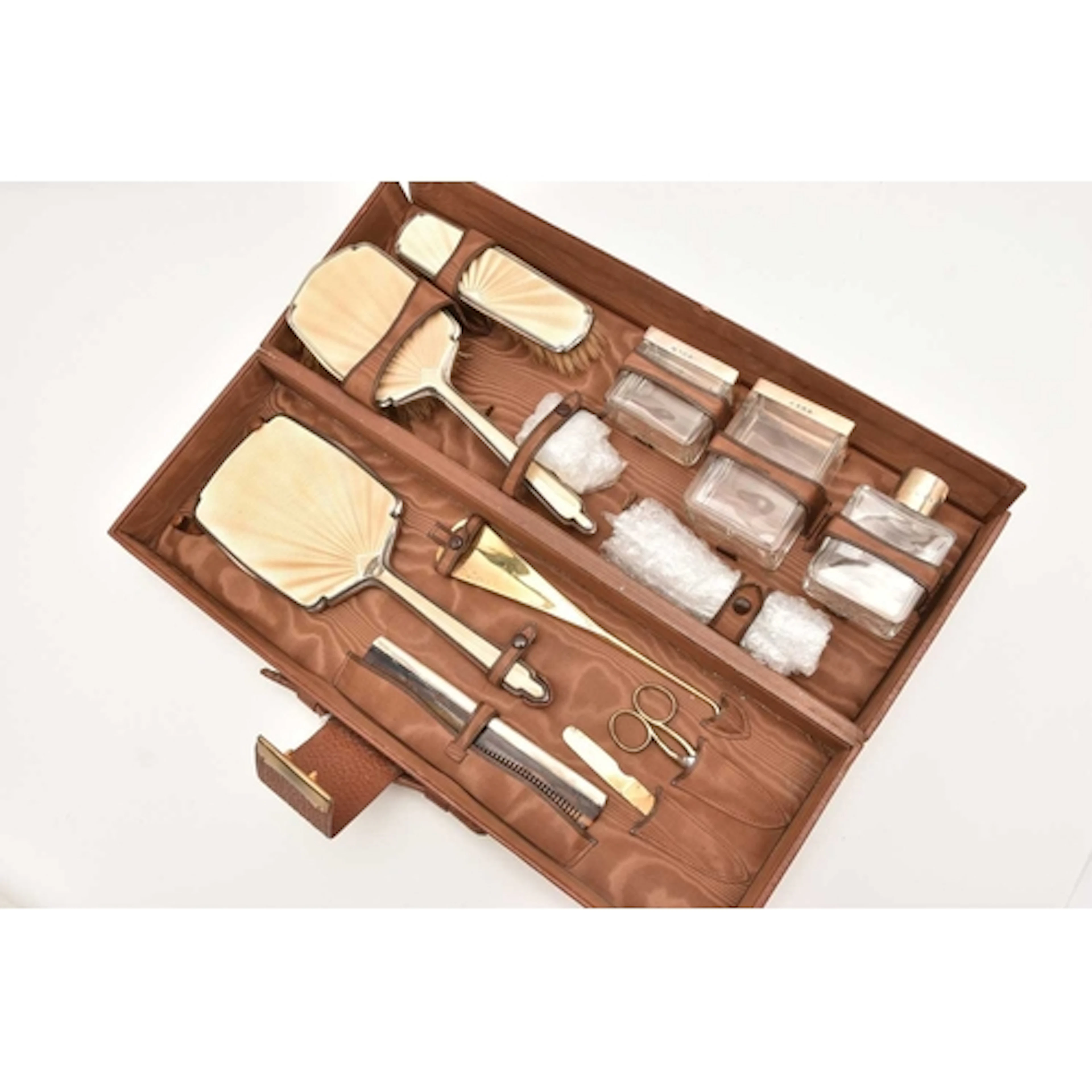 A TRAVEL CASE SILVER AND ENAMEL DRESSING TABLE SET, comprisi...