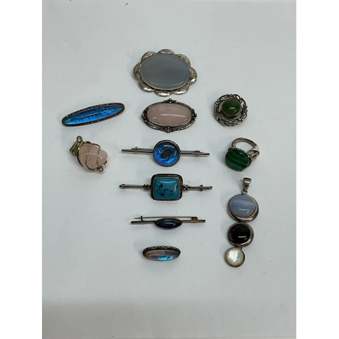 A group of silver polished stone set jewellery