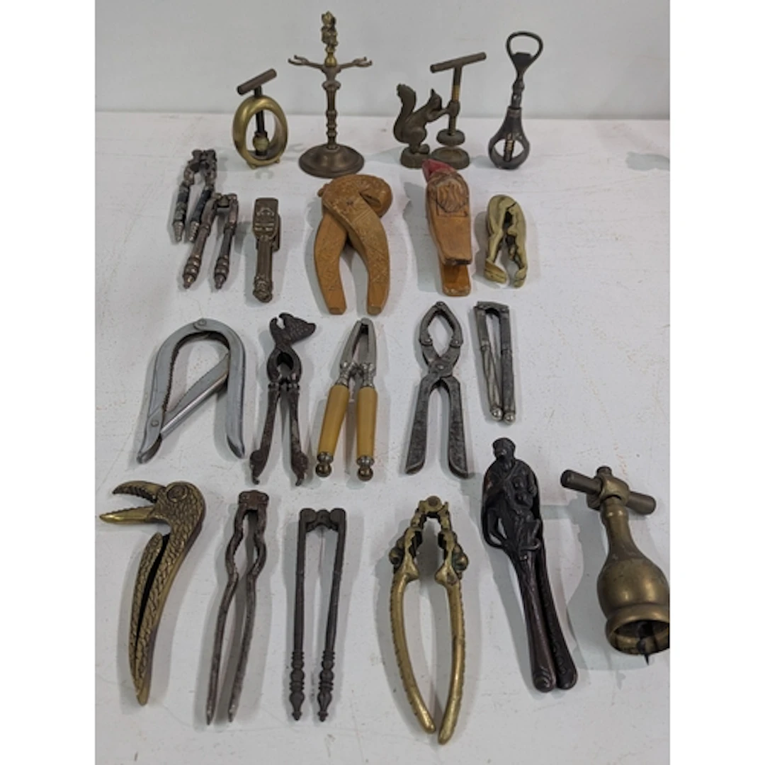 A collection of vintage nut crackers to include a brass squi...