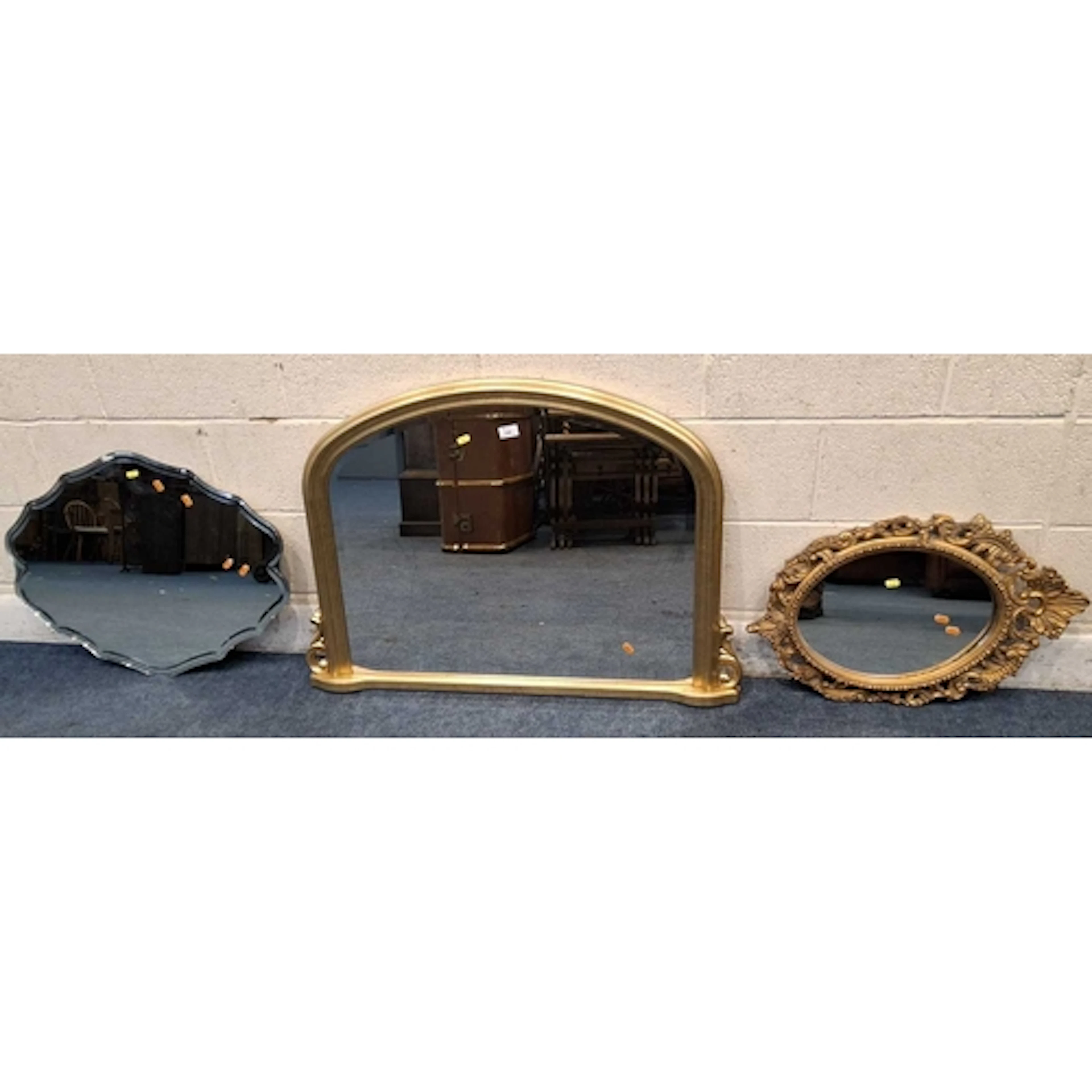 A GILT WOOD BEVELLED EDGE OVER MANTEL MIRROR, along with two...