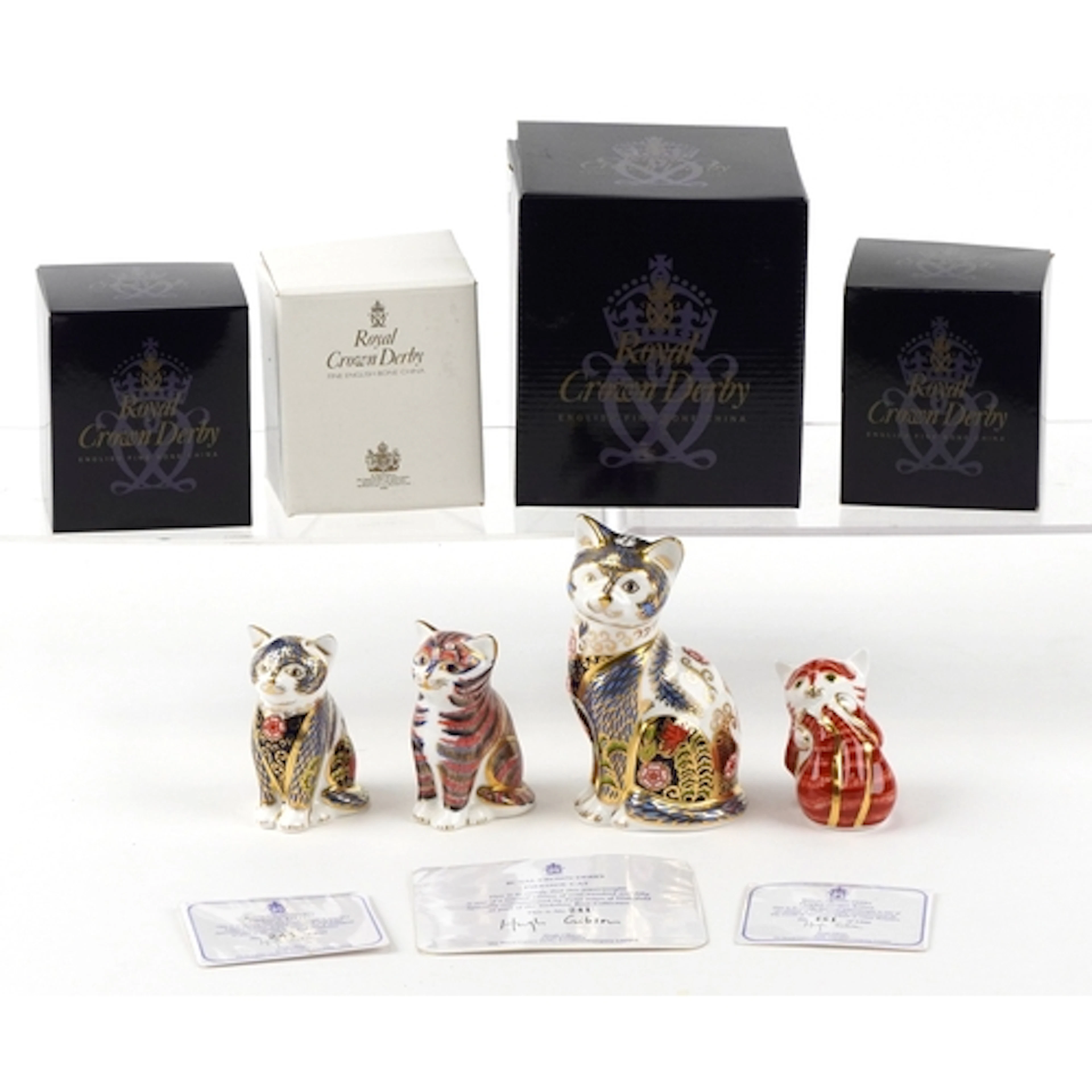 Four Royal Crown Derby paperweights comprising two Fireside ...